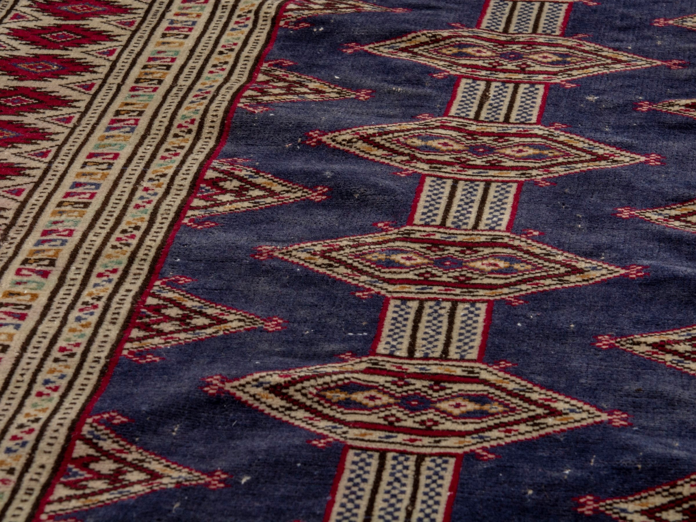 Persian Torkaman accent rug in navy and burgundy, view 8 of 17