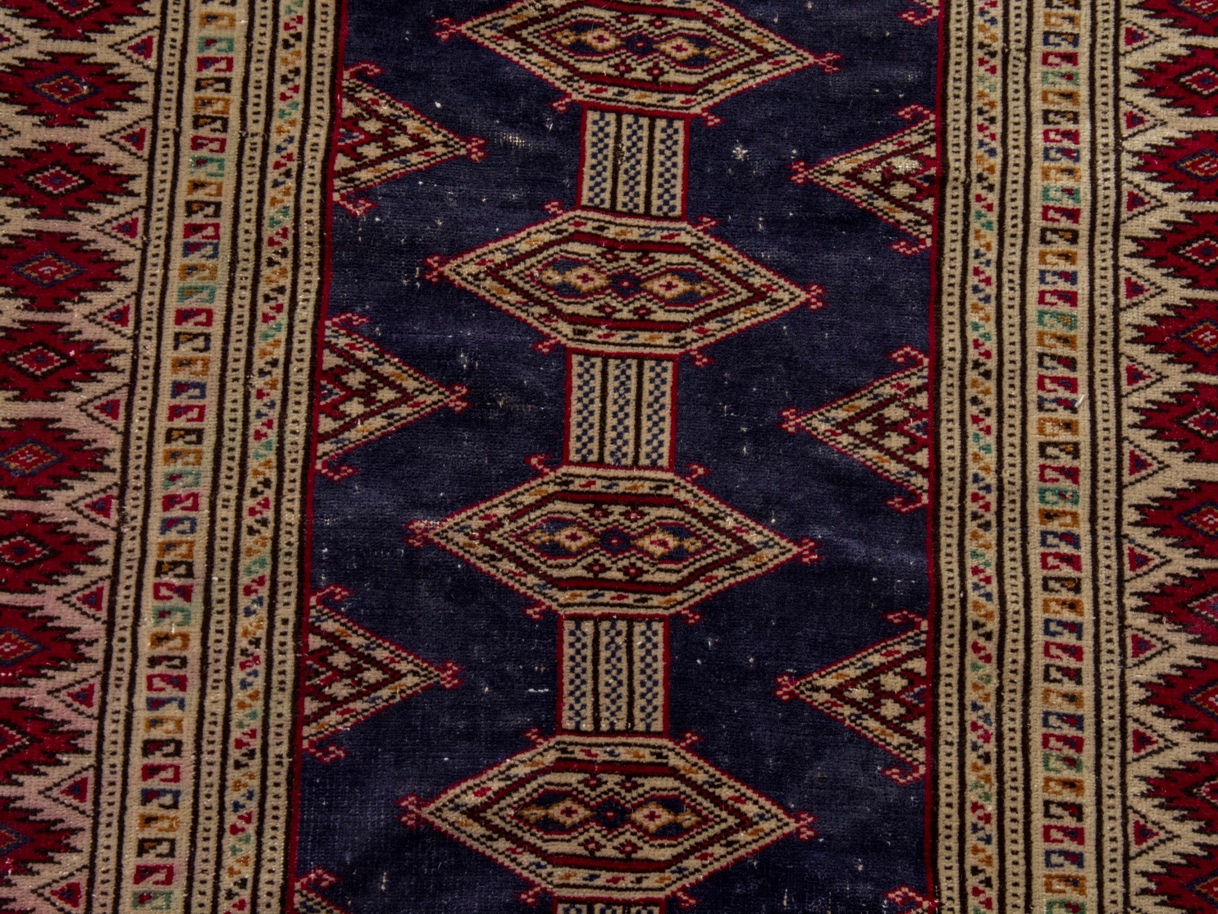 Persian Torkaman accent rug in navy and burgundy, view 12 of 17