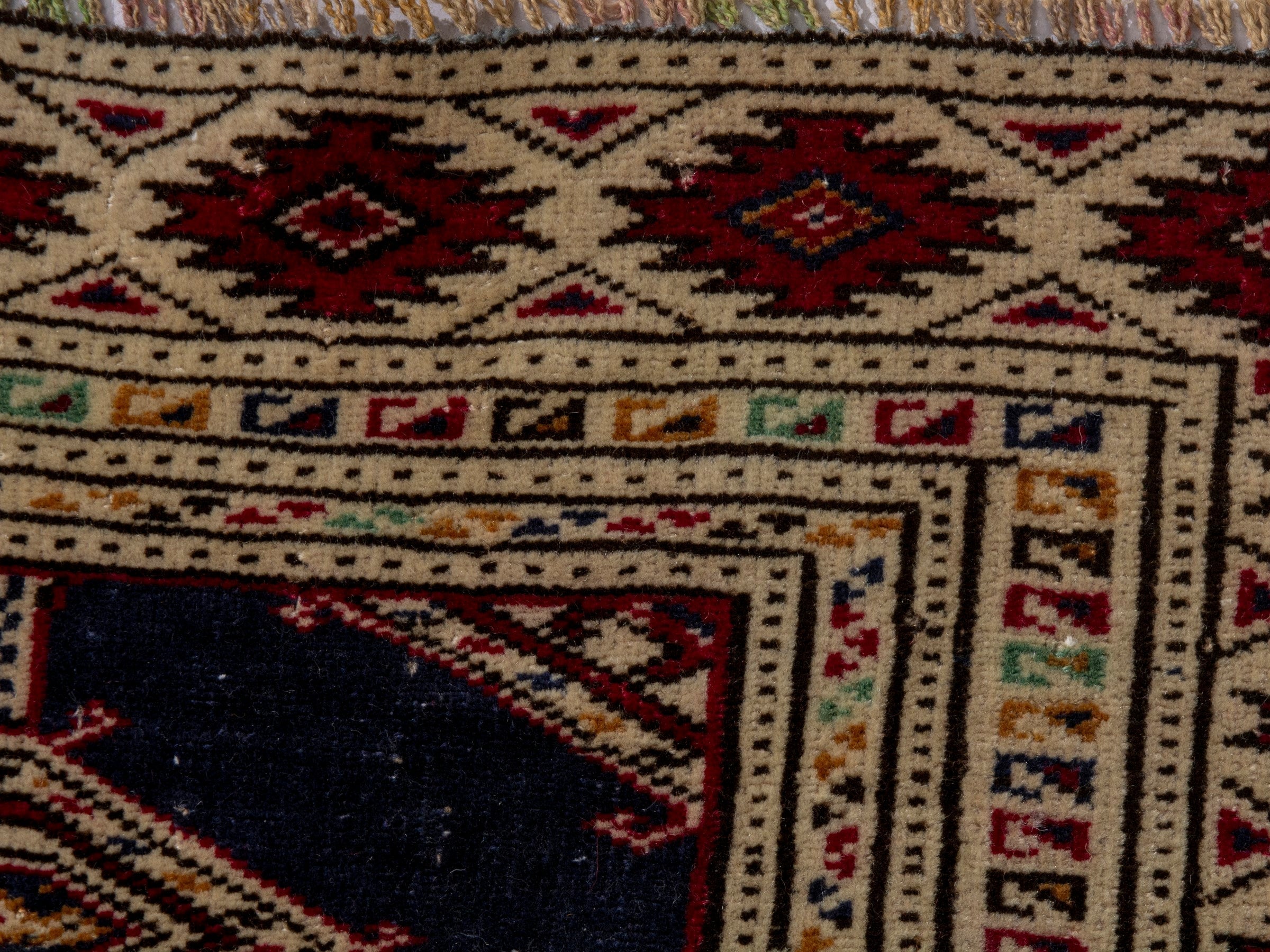 Persian Torkaman accent rug in navy and burgundy, view 13 of 17