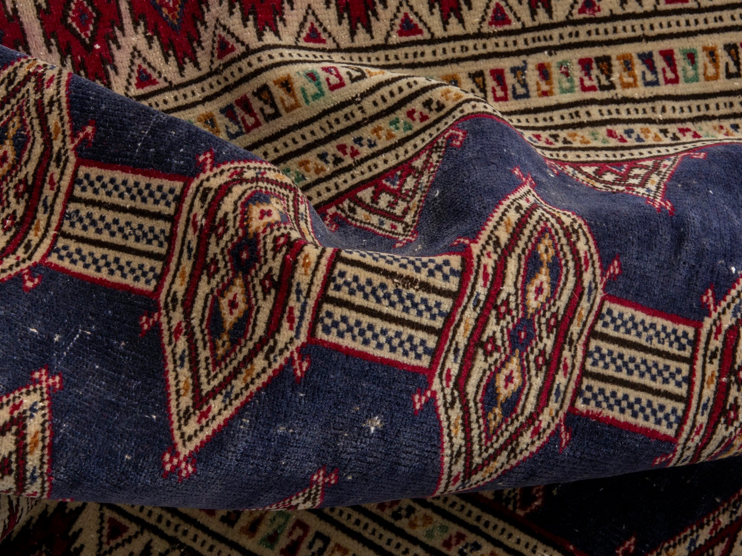 Persian Torkaman accent rug in navy and burgundy, view 14 of 17