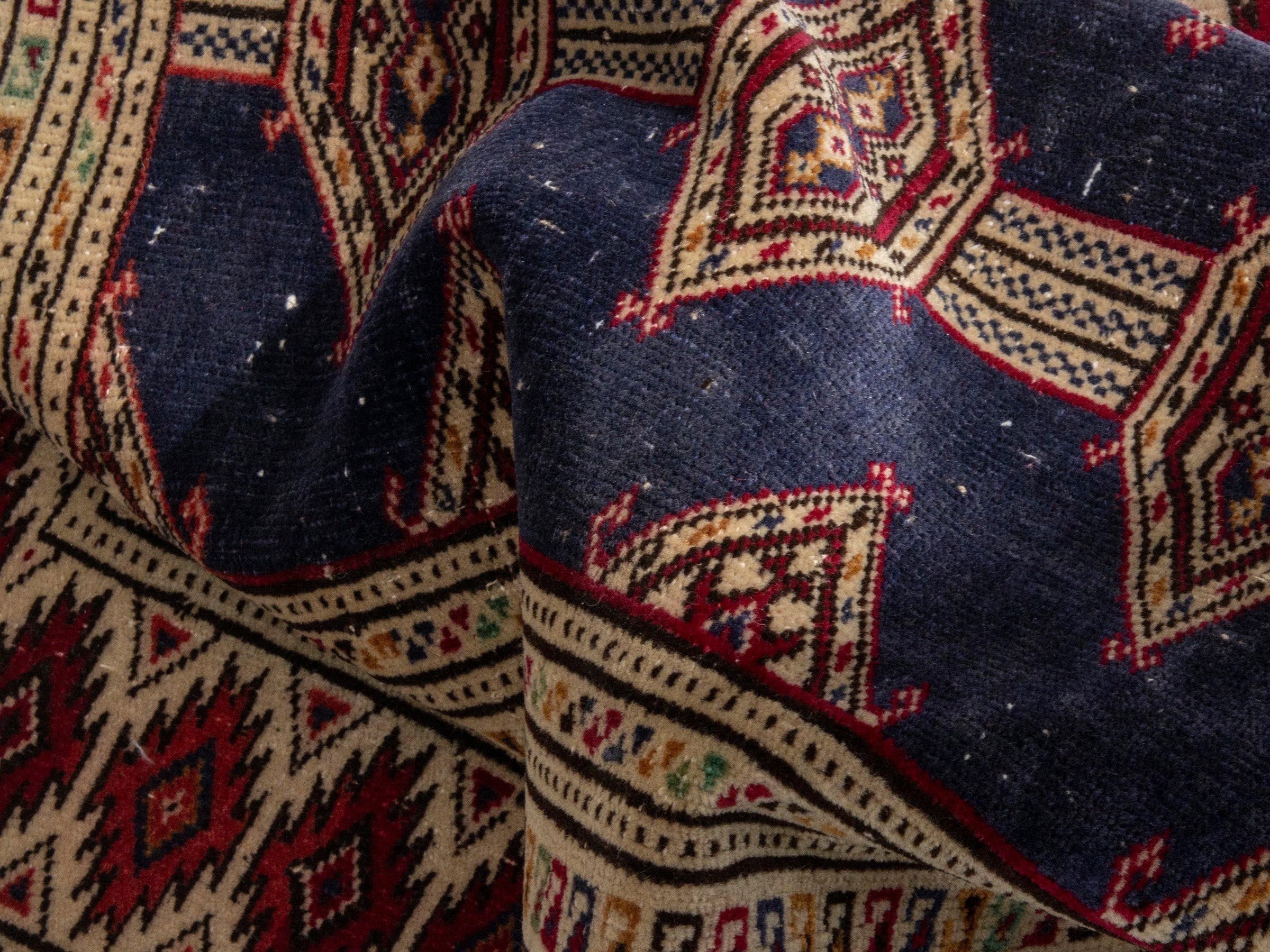 Persian Torkaman accent rug in navy and burgundy, view 15 of 17