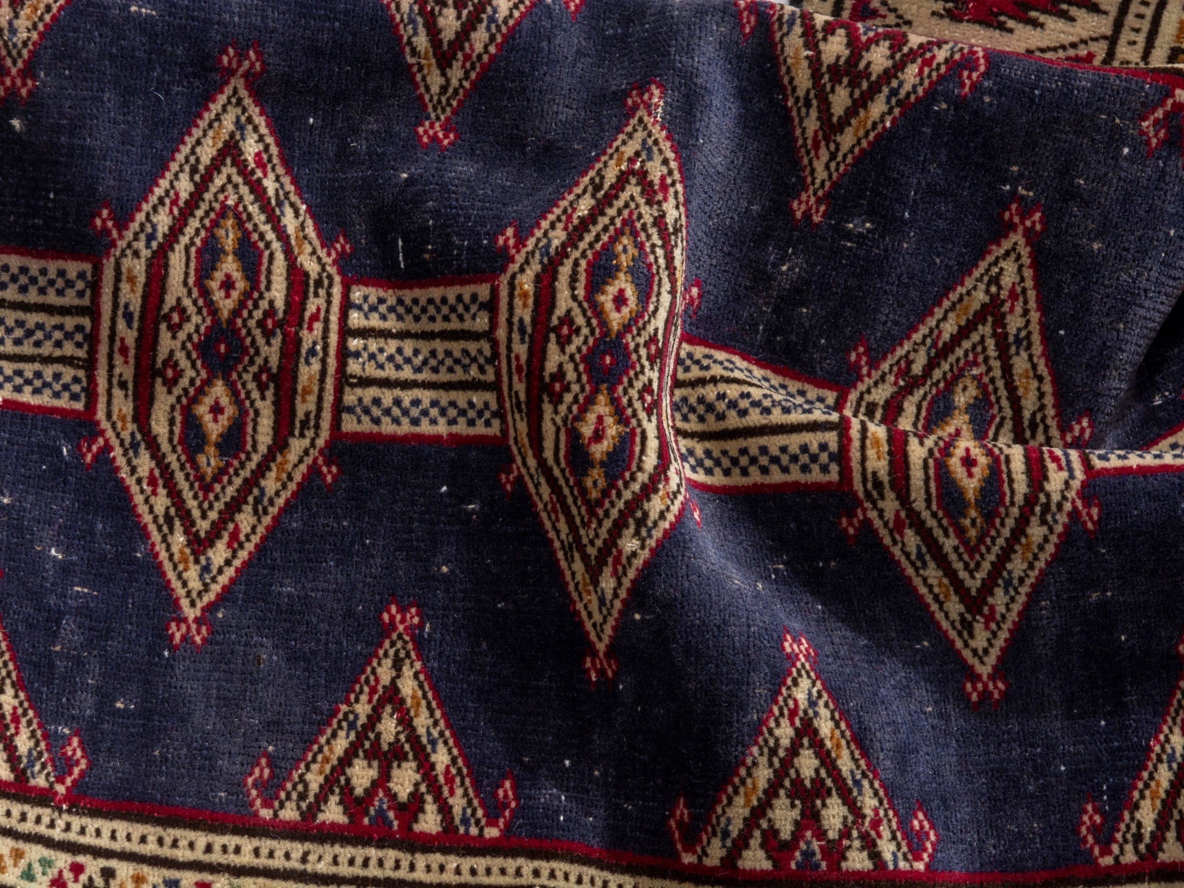 Persian Torkaman accent rug in navy and burgundy, view 16 of 17