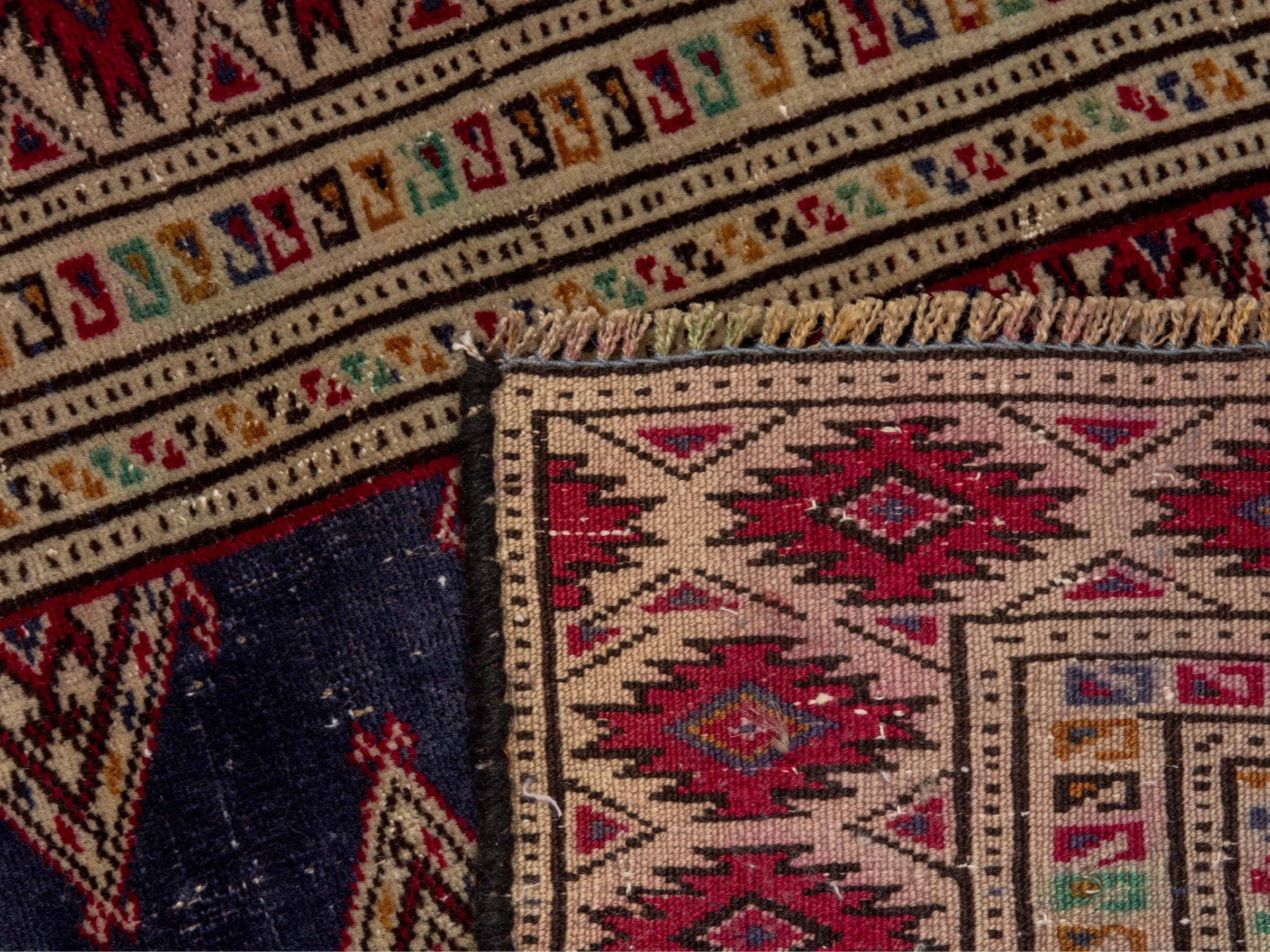 Persian Torkaman accent rug in navy and burgundy, view 17 of 17