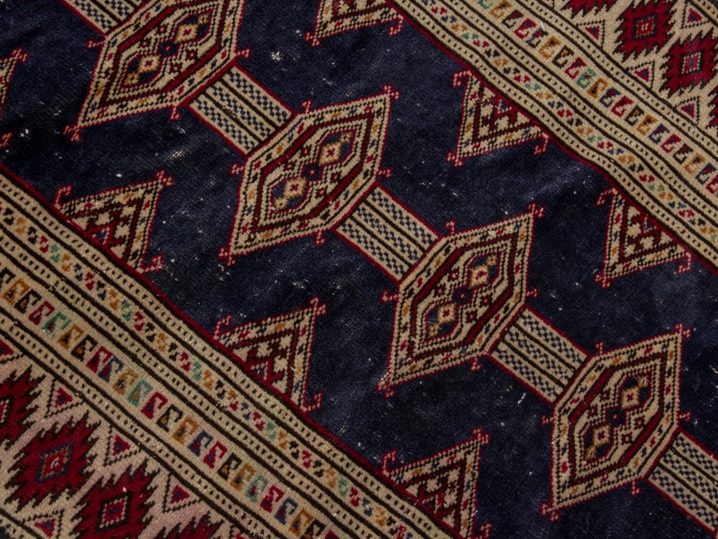 Persian Torkaman accent rug in navy and burgundy, view 4 of 17