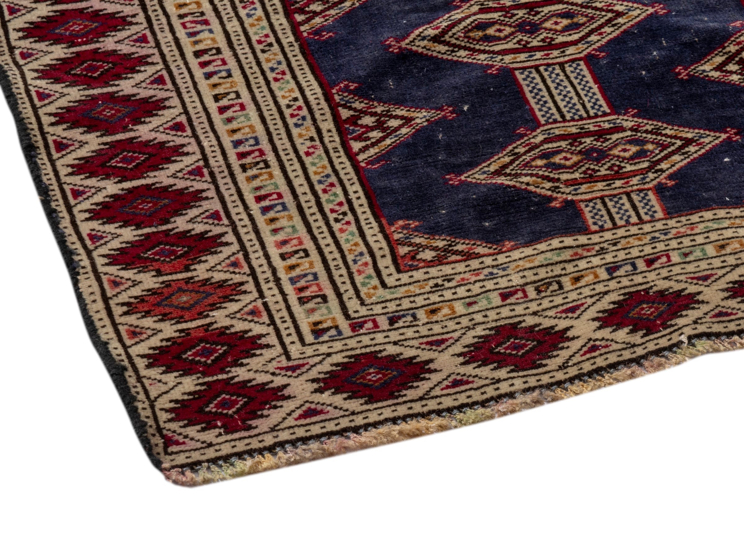 Persian Torkaman accent rug in navy and burgundy, view 5 of 17