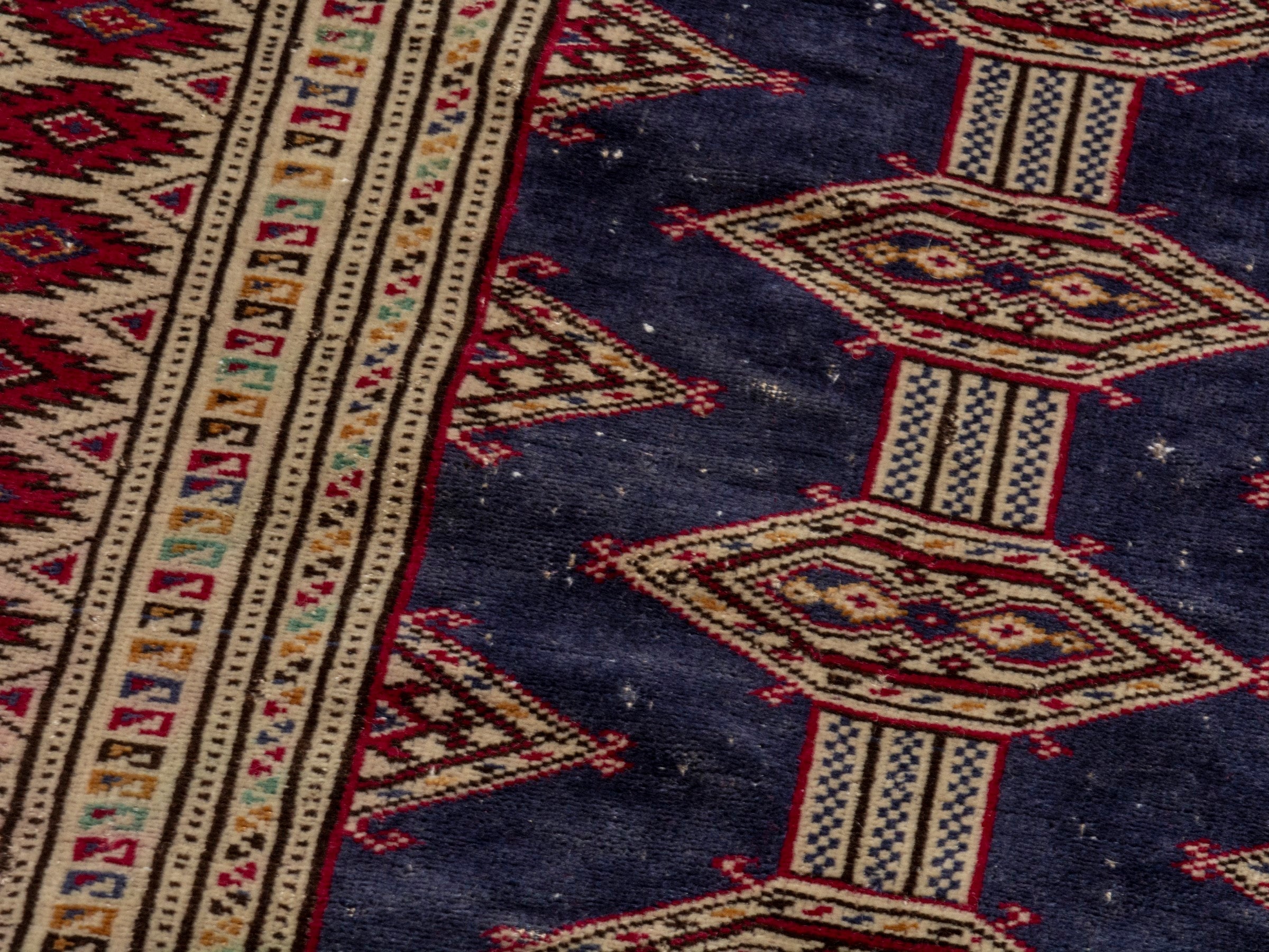 Persian Torkaman accent rug in navy and burgundy, view 9 of 17