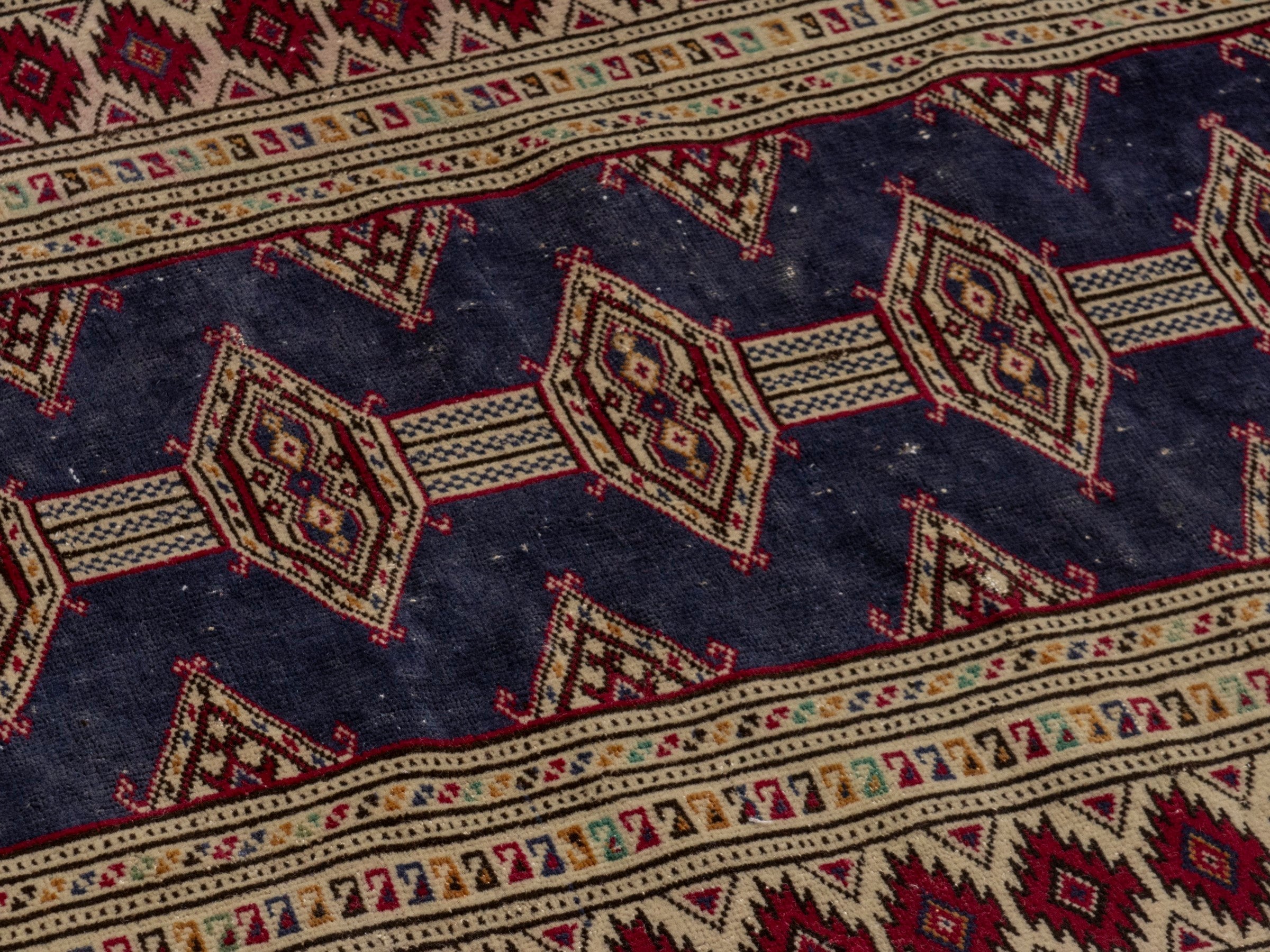 Persian Torkaman accent rug in navy and burgundy, view 6 of 17