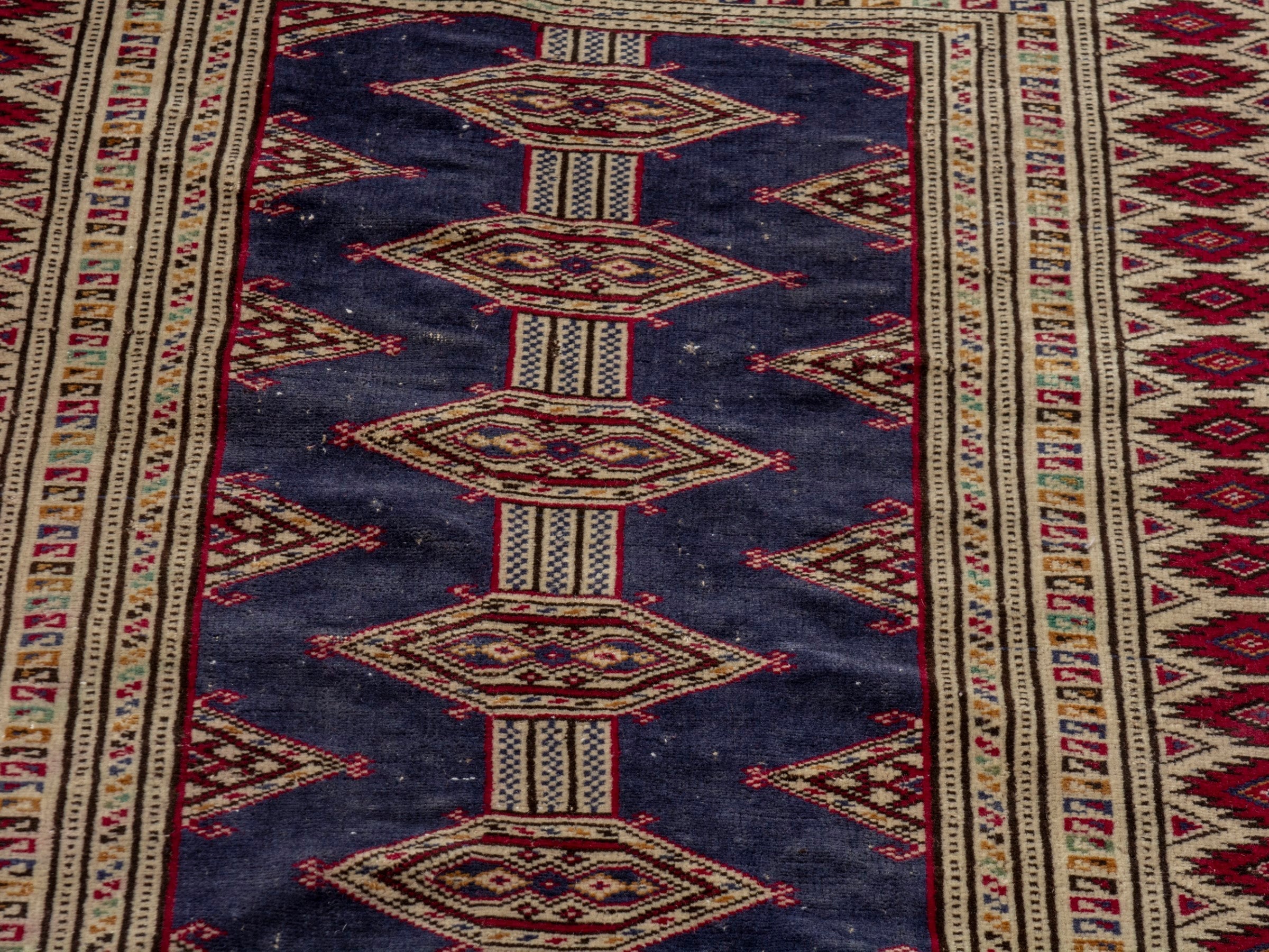 Persian Torkaman accent rug in navy and burgundy, view 7 of 17