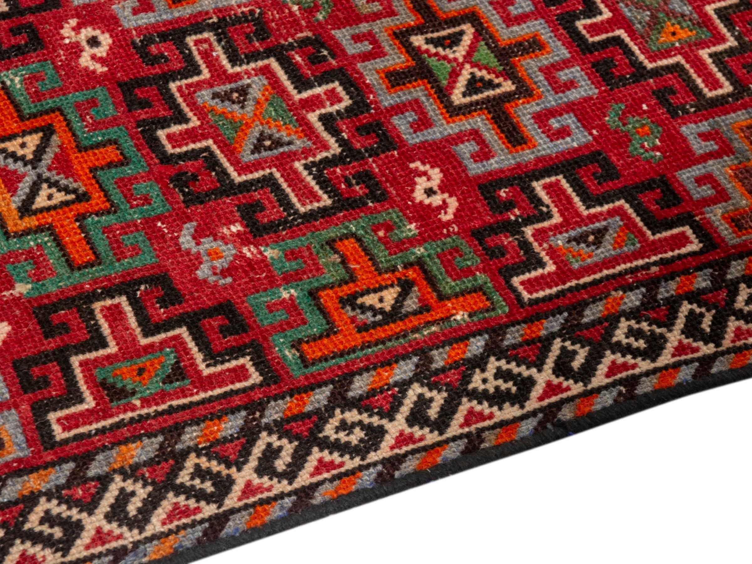 Persian Baluch accent rug in deep red and cream, view 6 of 18