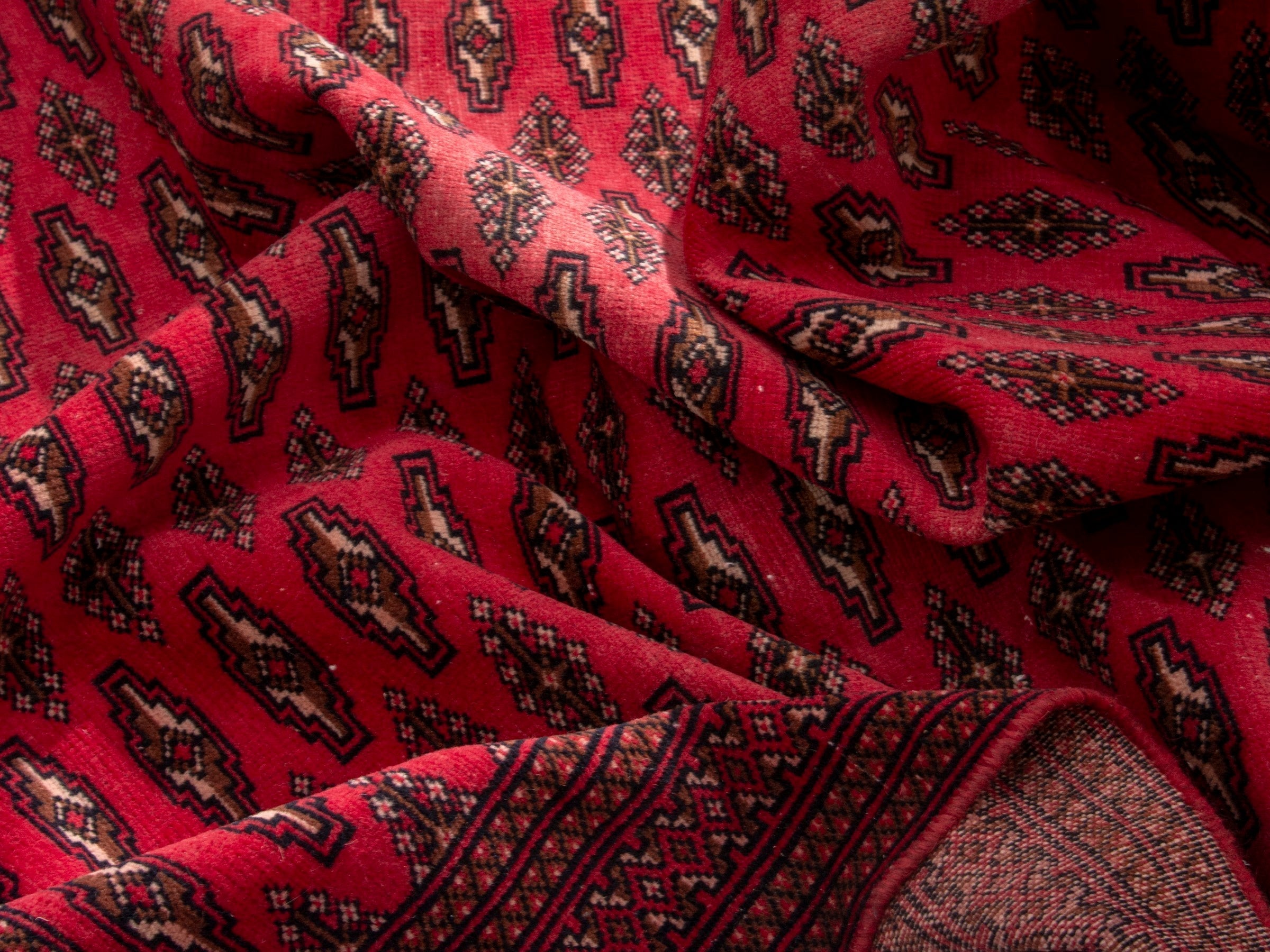 Persian Torkaman accent rug in deep red and burgundy, view 16 of 17