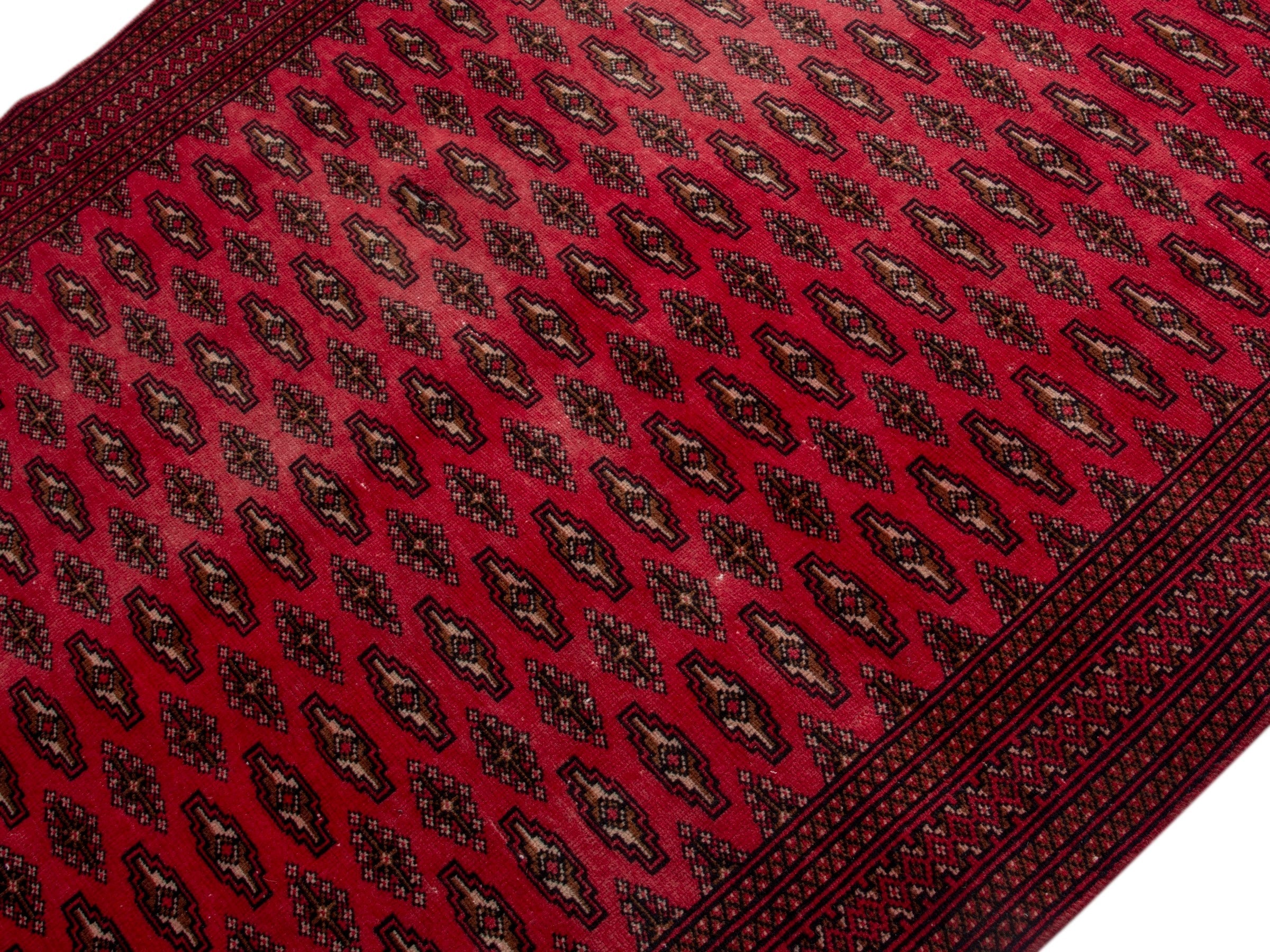 Persian Torkaman accent rug in deep red and burgundy, view 4 of 17