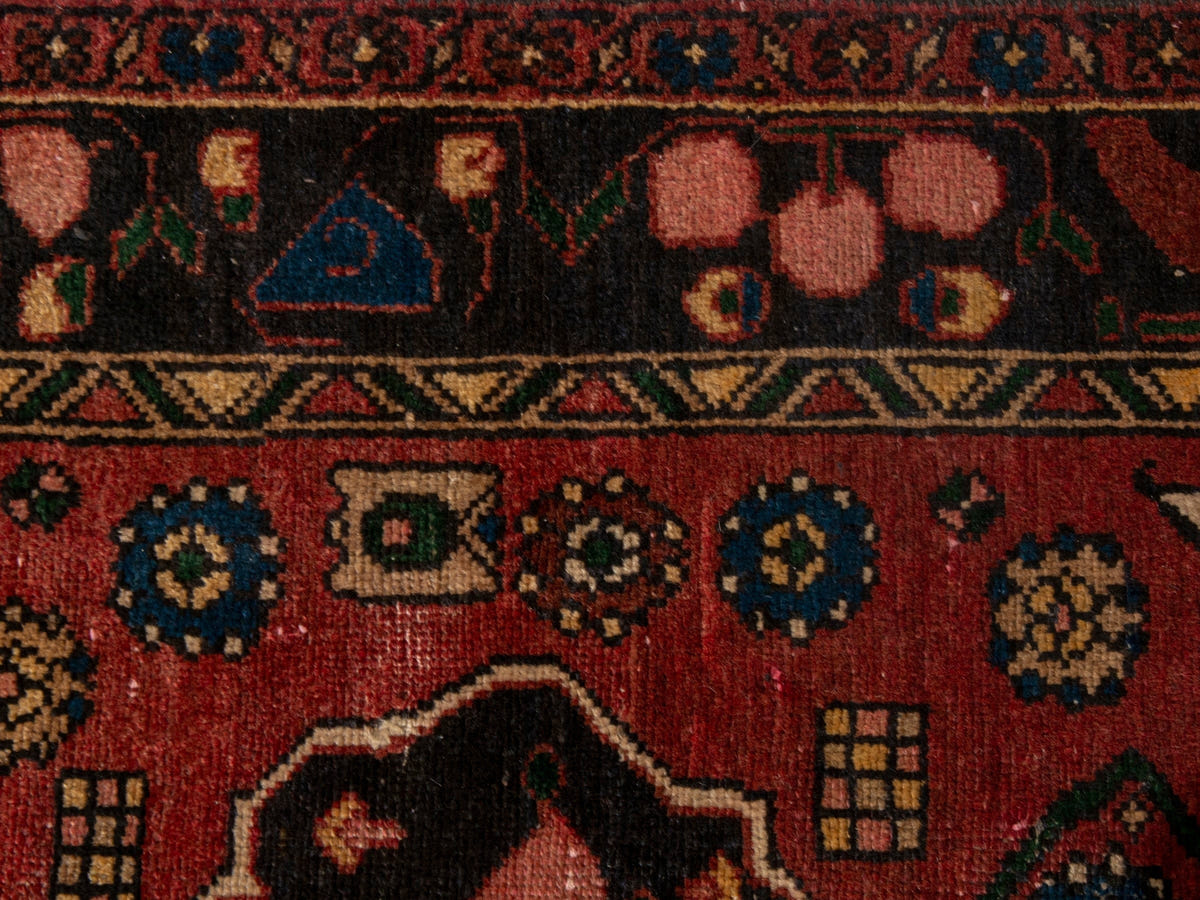 Persian Zanjan area rug in deep red and black, view 15 of 20