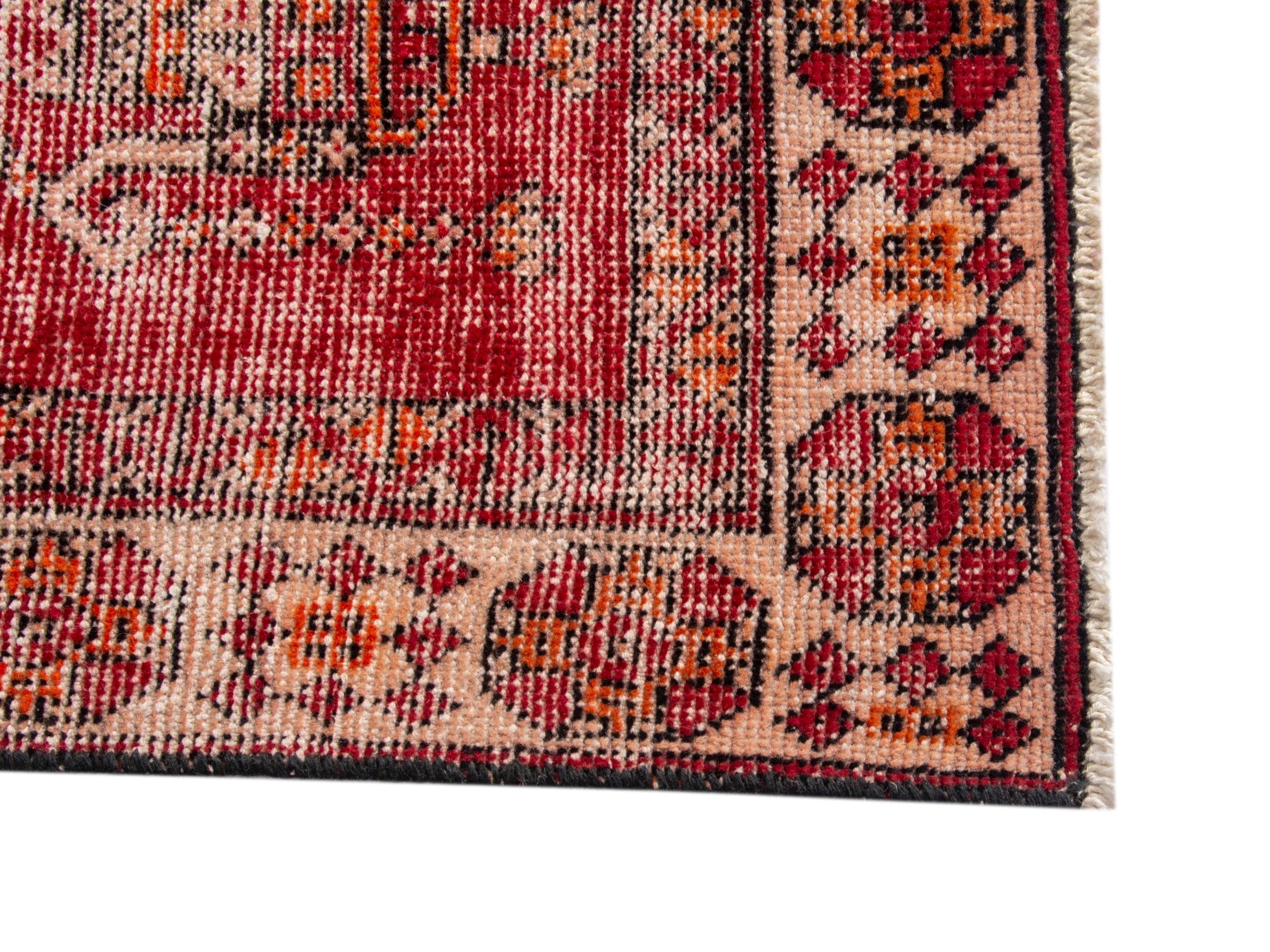 Persian Ferdos accent rug in burgundy and terracotta, view 10 of 17