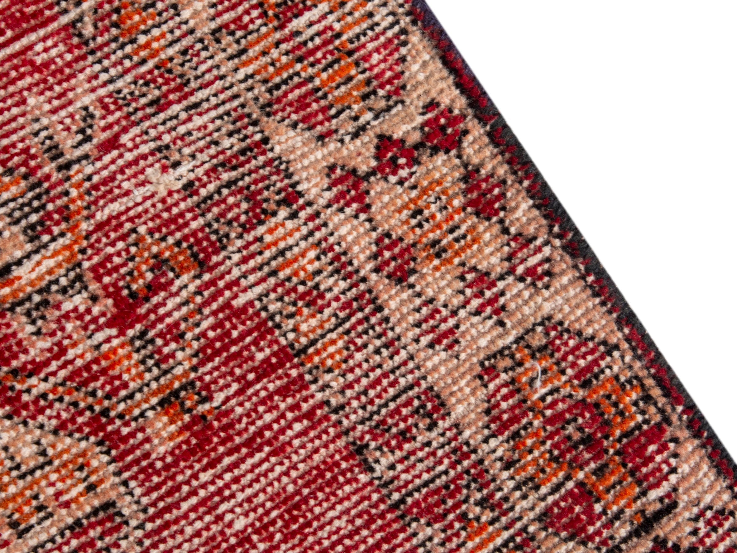 Persian Ferdos accent rug in burgundy and terracotta, view 9 of 17
