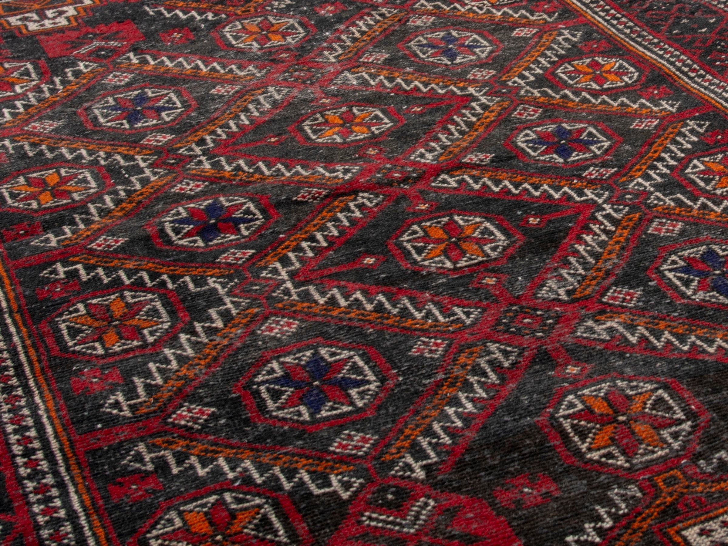 Persian Baluch accent rug in deep red and burgundy, view 8 of 17