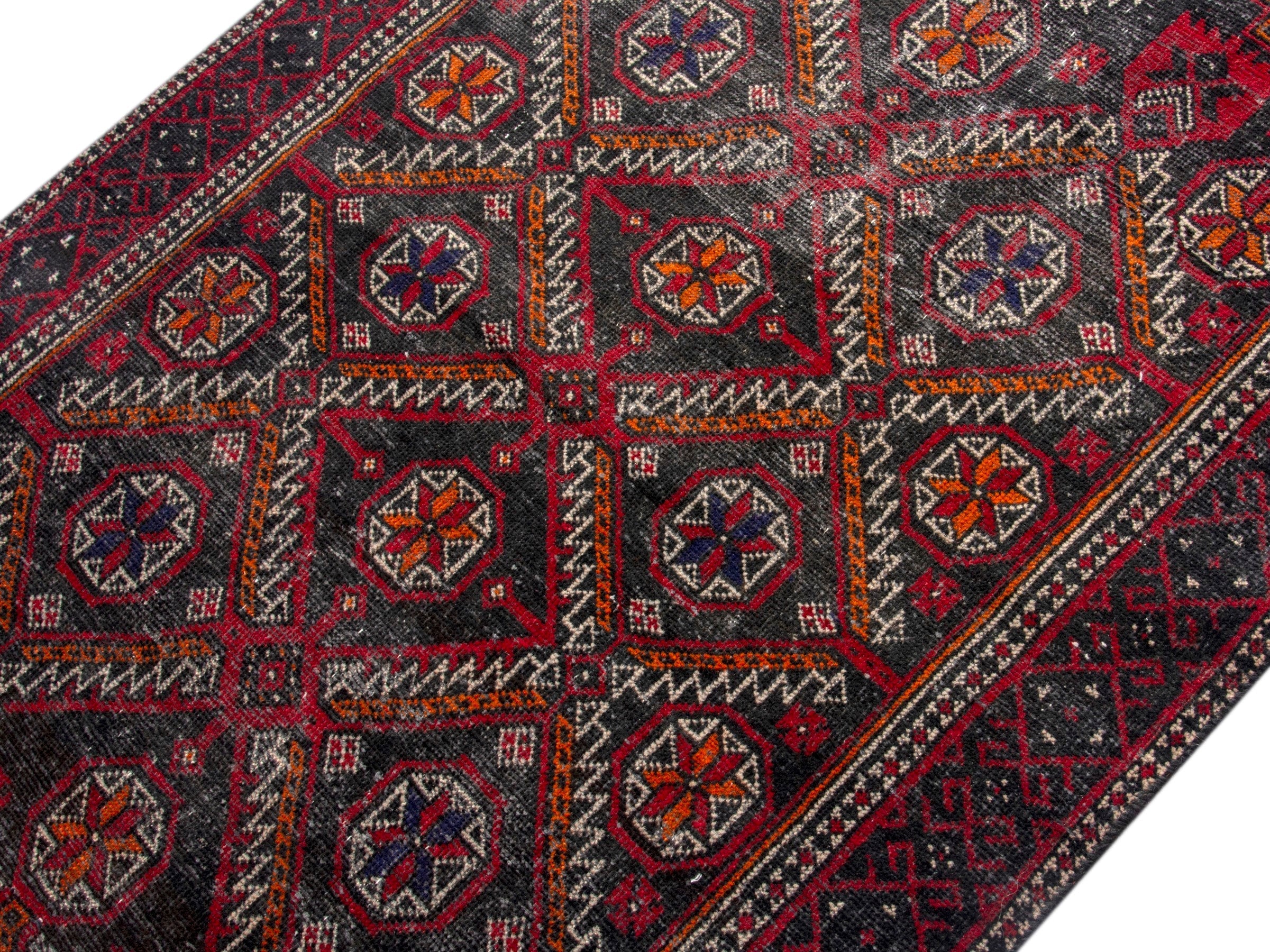Persian Baluch accent rug in deep red and burgundy, view 4 of 17
