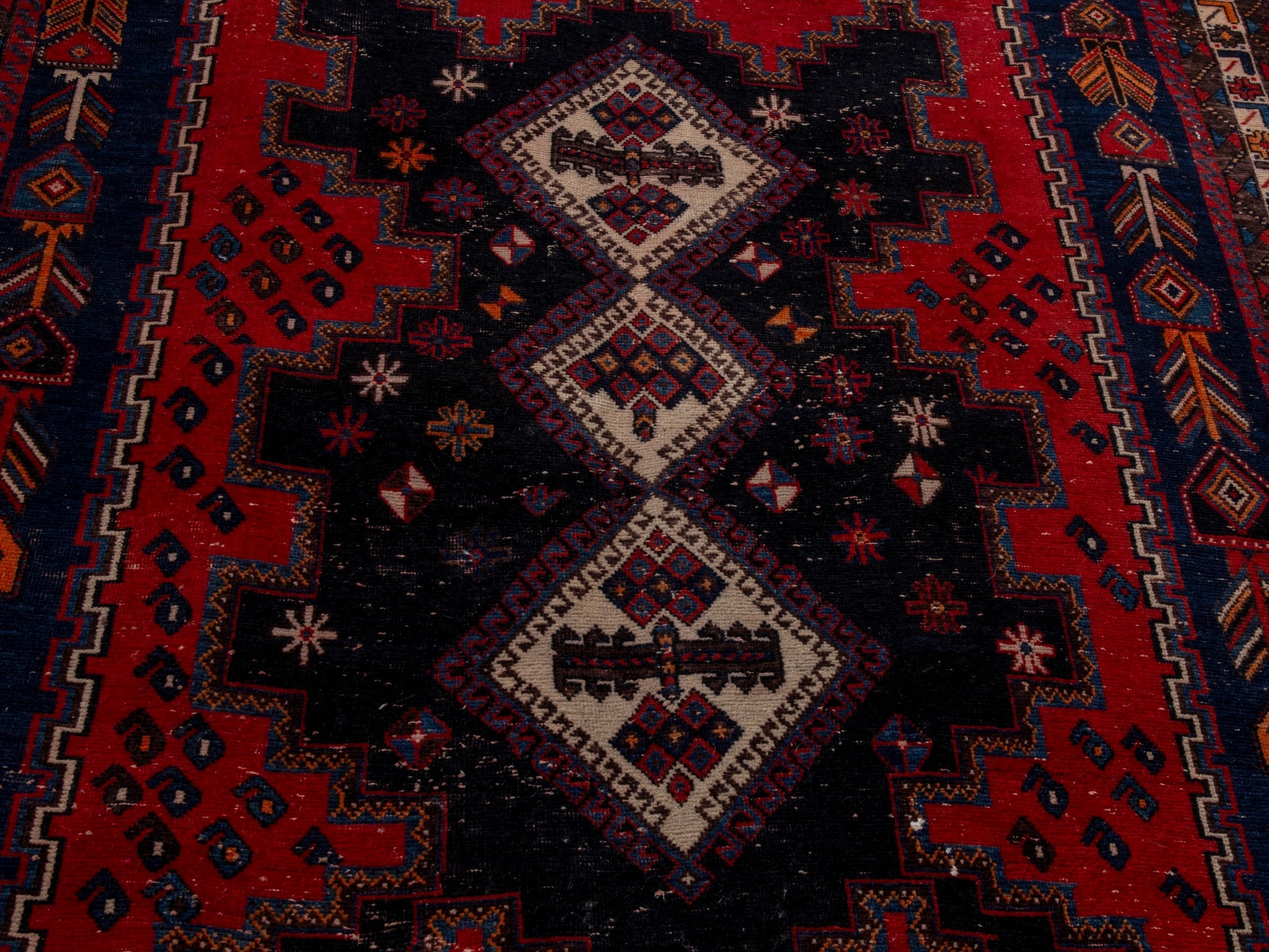 Persian Sirjan area rug in deep red and navy, view 9 of 22
