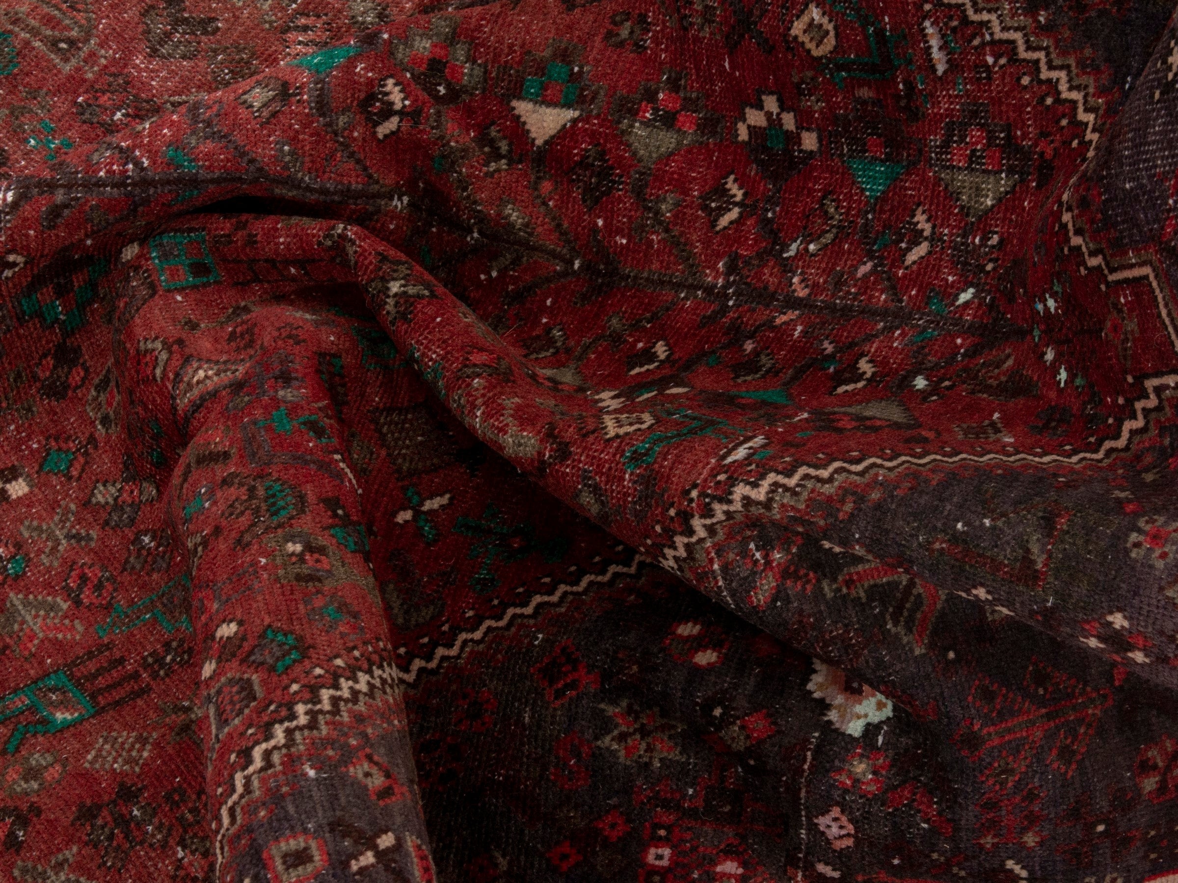 Persian Shiraz area rug in faded red and dark brown, view 14 of 15