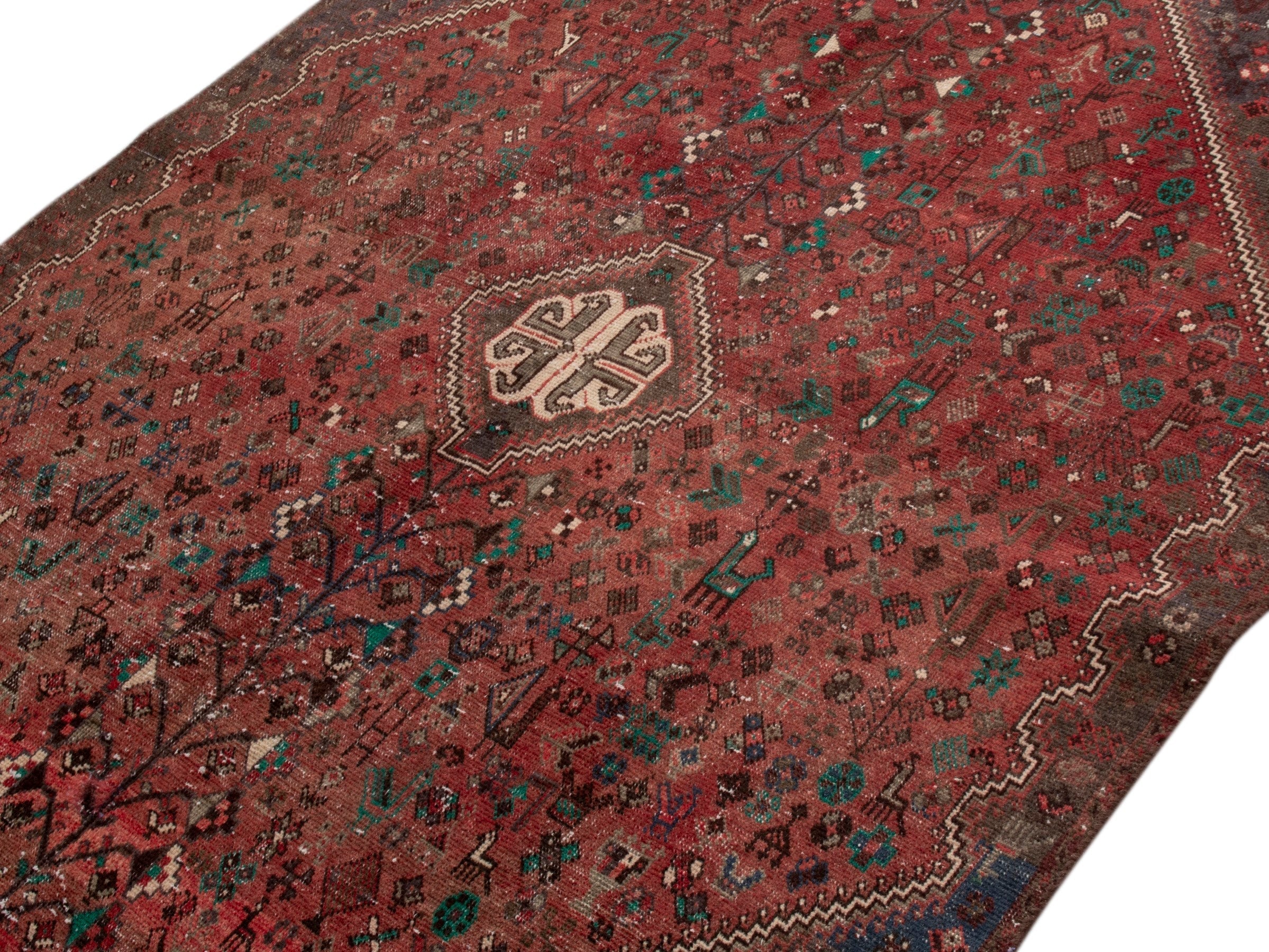 Persian Shiraz area rug in faded red and dark brown, view 4 of 15