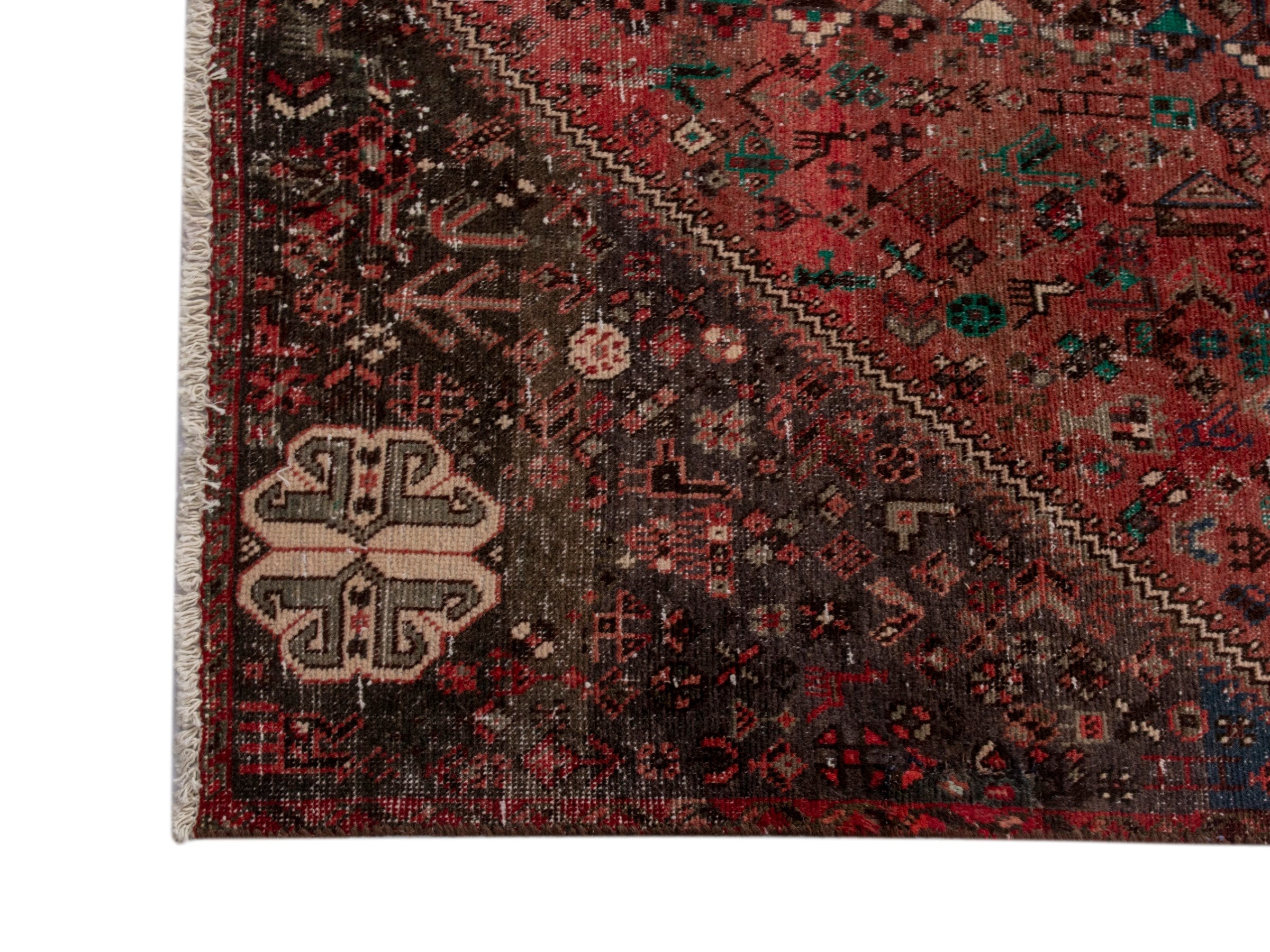 Persian Shiraz area rug in faded red and dark brown, view 10 of 15