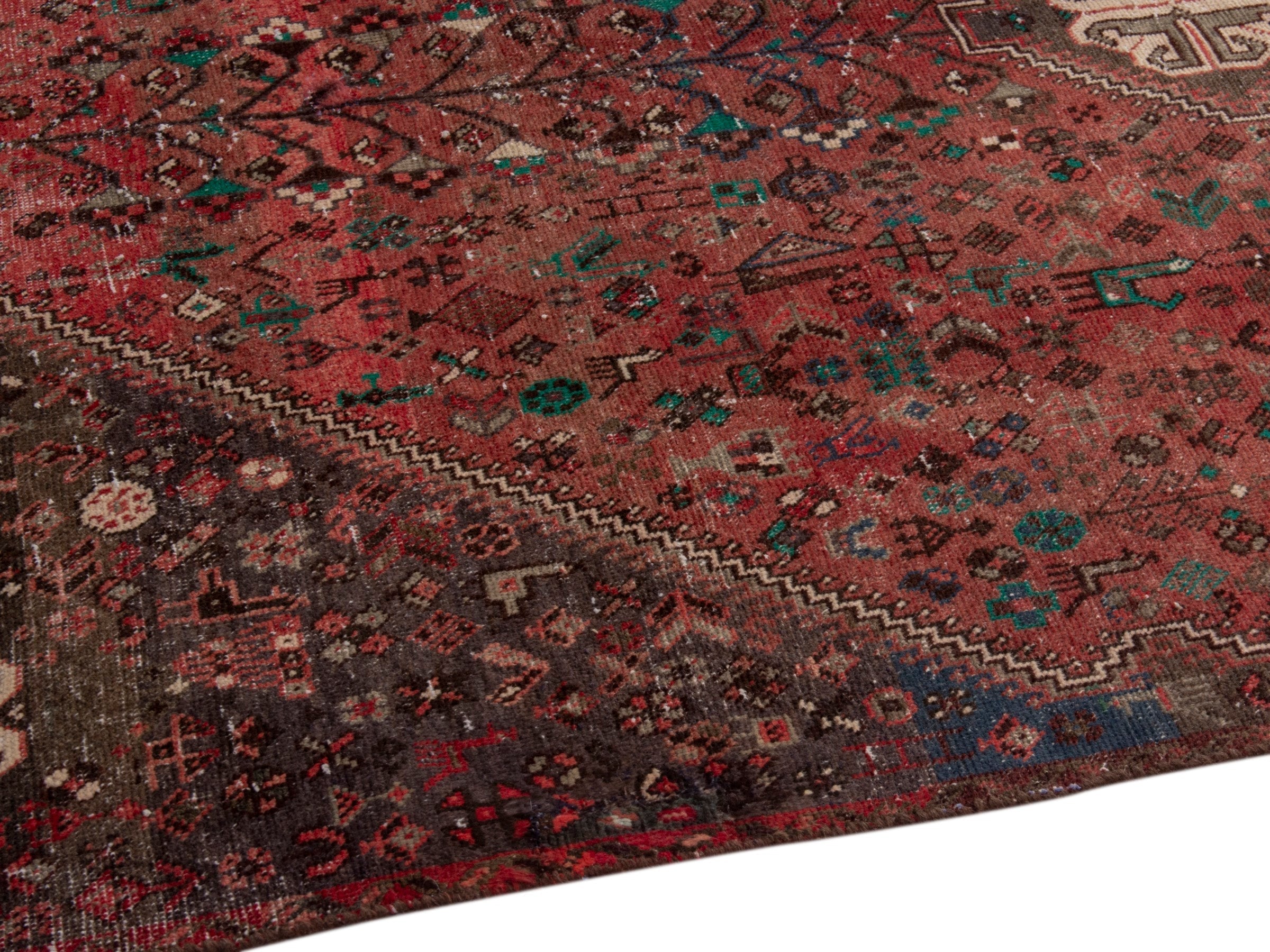 Persian Shiraz area rug in faded red and dark brown, view 6 of 15