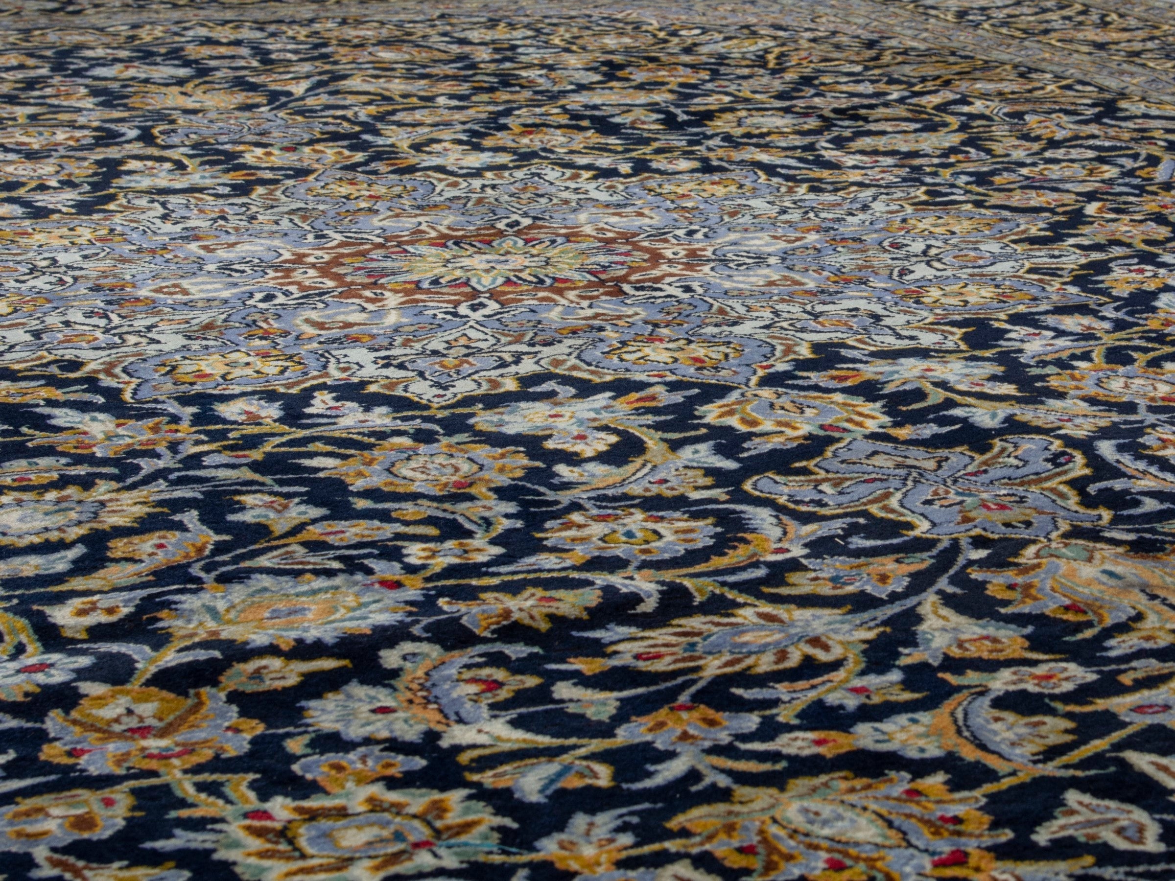 Persian Kashan oversized rug in navy and tan, view 8 of 20
