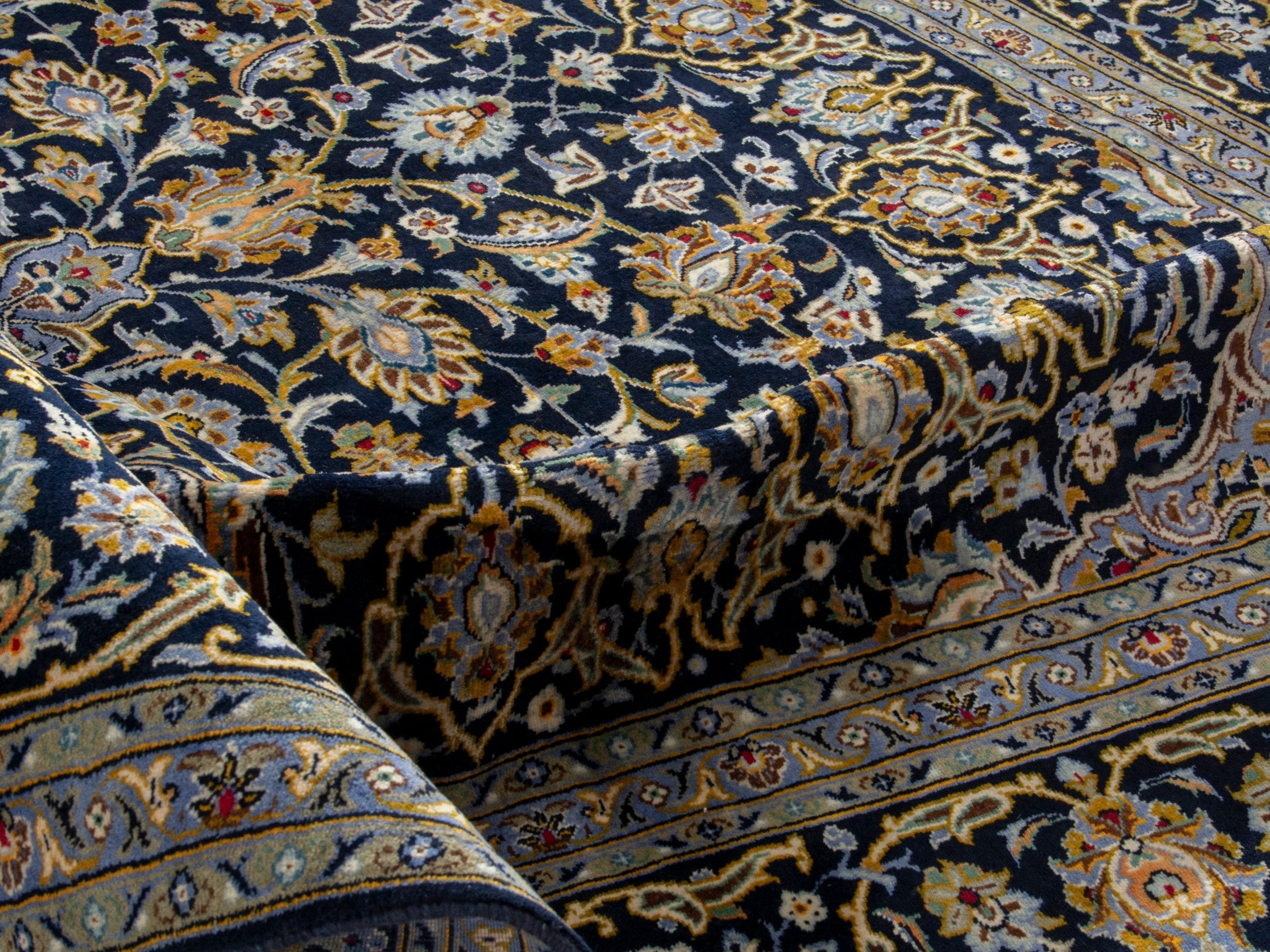 Persian Kashan oversized rug in navy and tan, view 16 of 20