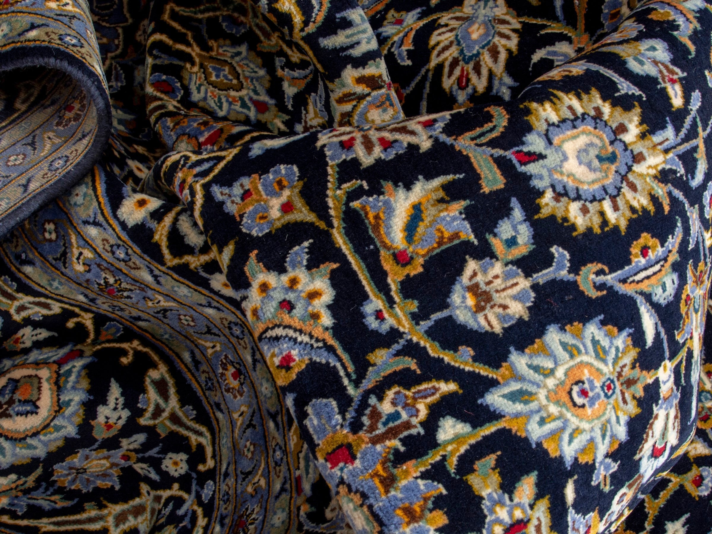 Persian Kashan oversized rug in navy and tan, view 17 of 20