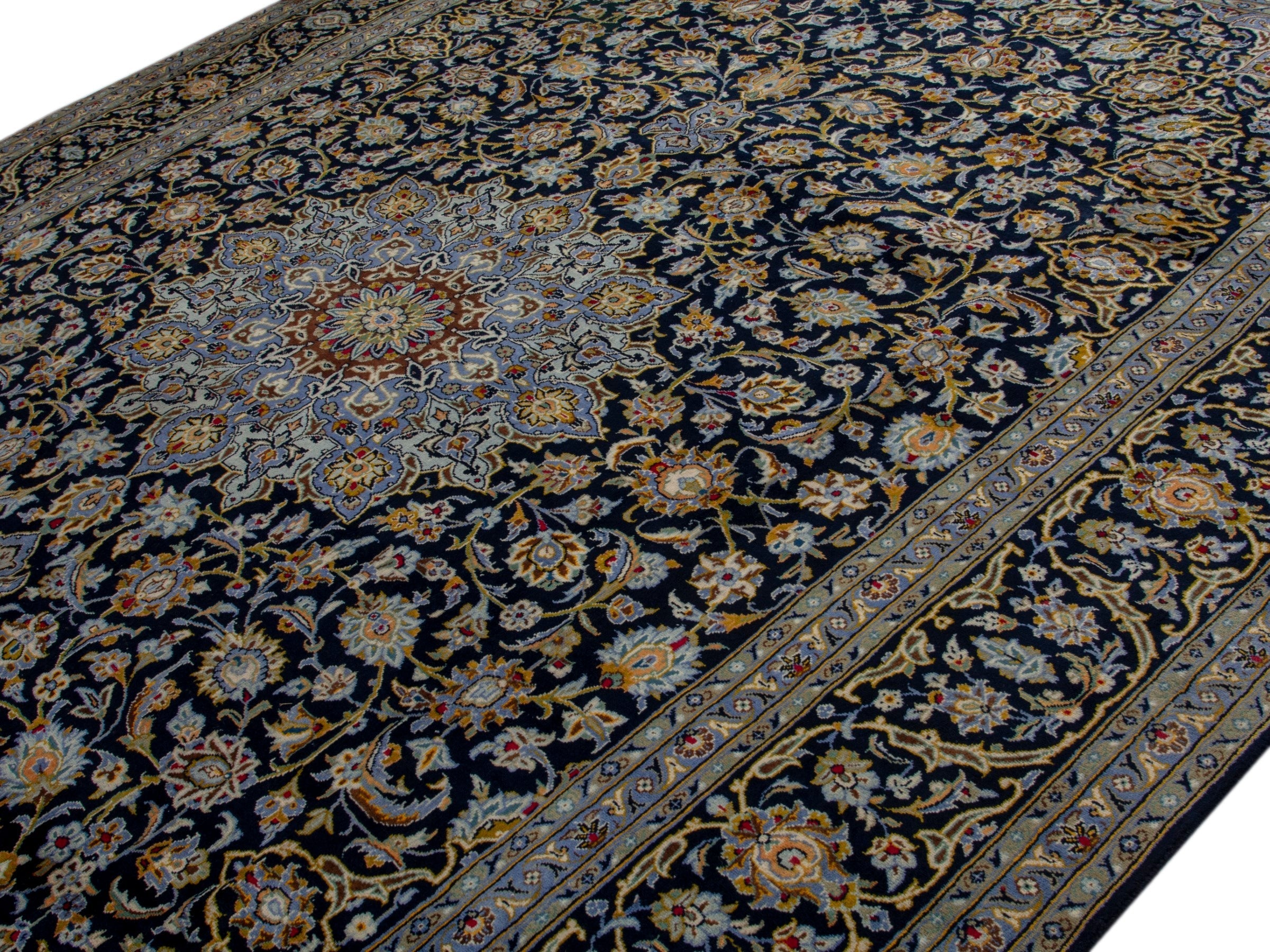 Persian Kashan oversized rug in navy and tan, view 4 of 20