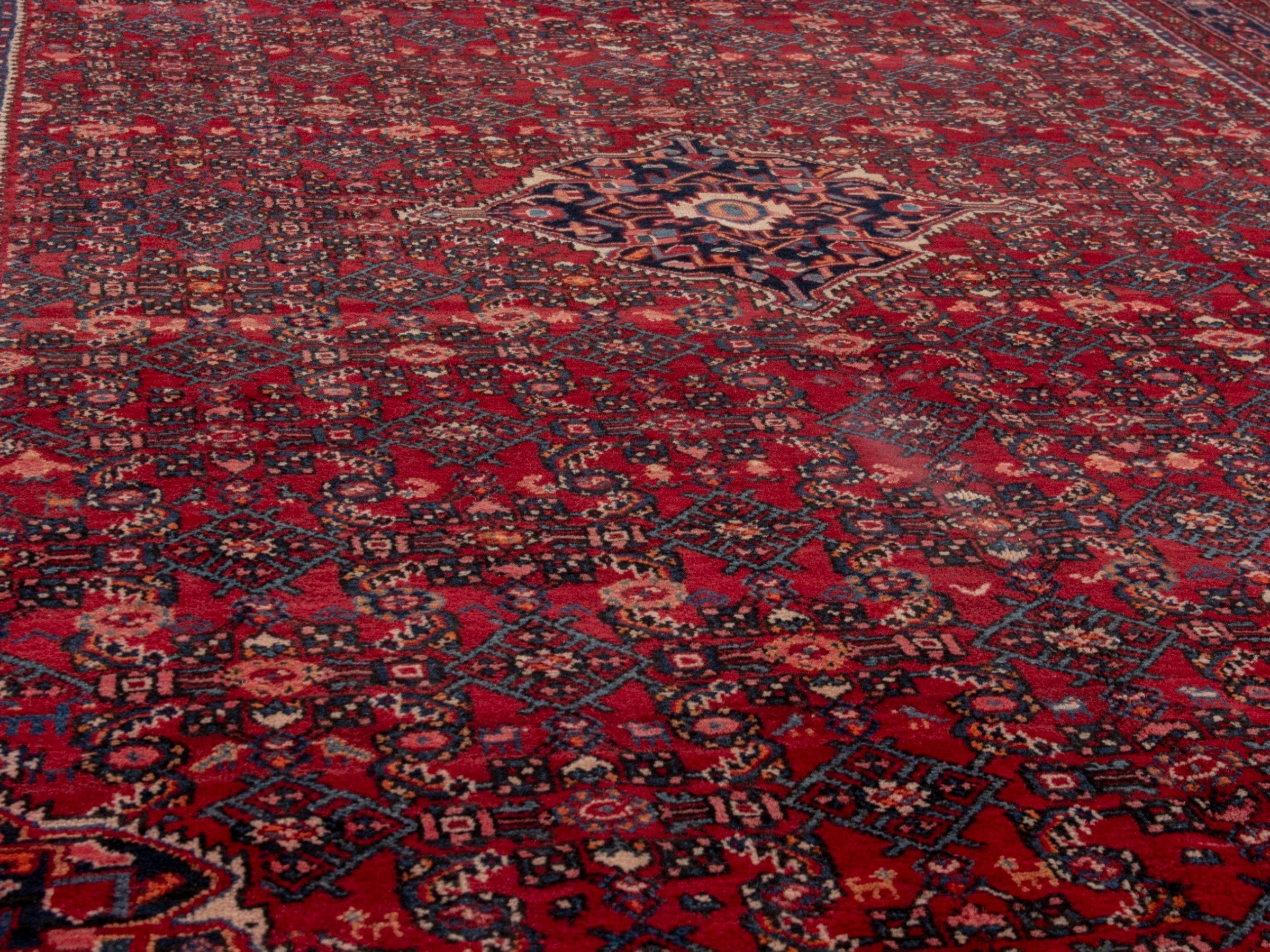 Persian Hosseinabad oversized rug in burgundy and navy, view 8 of 19