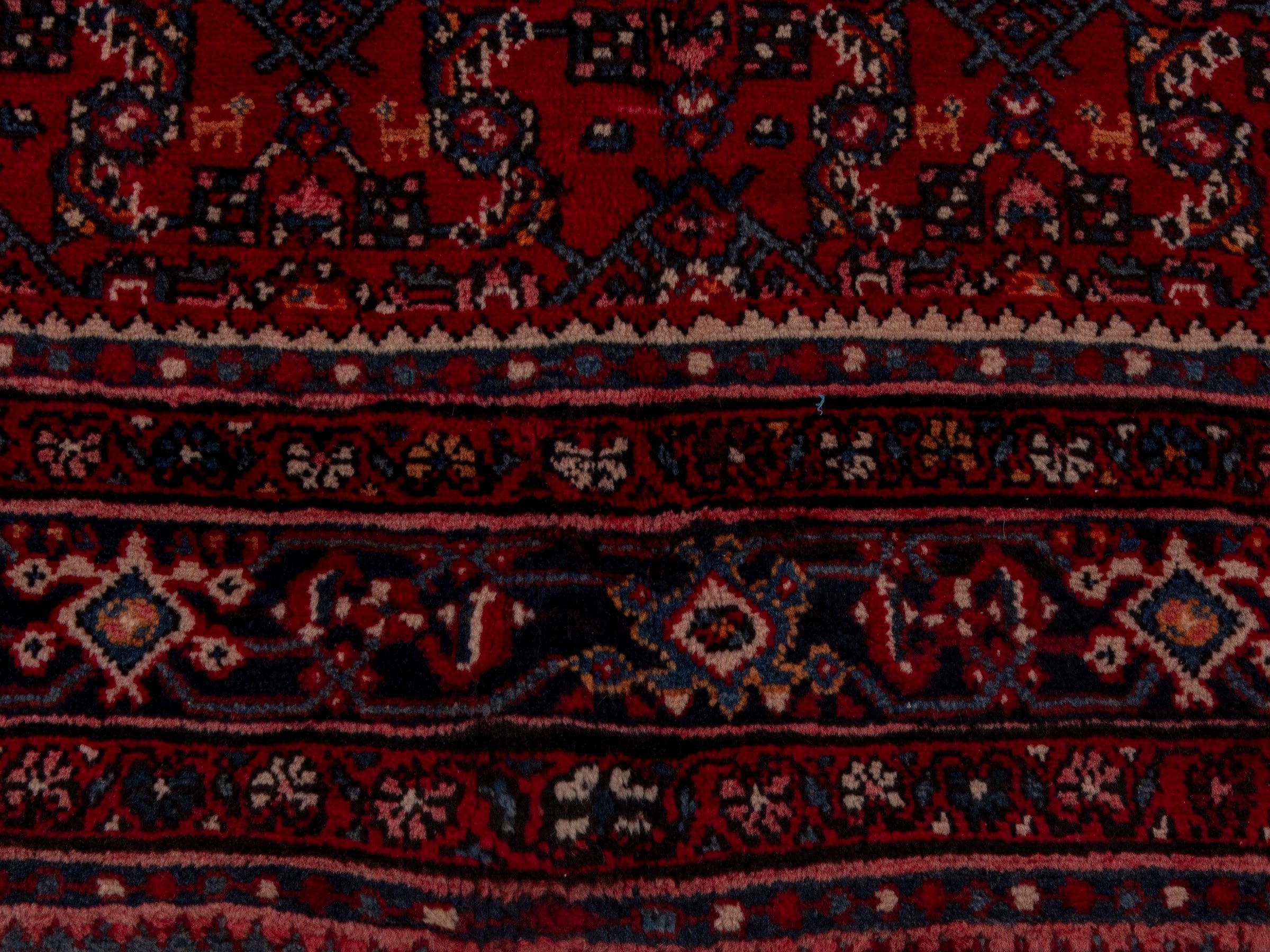 Persian Hosseinabad oversized rug in burgundy and navy, view 11 of 19