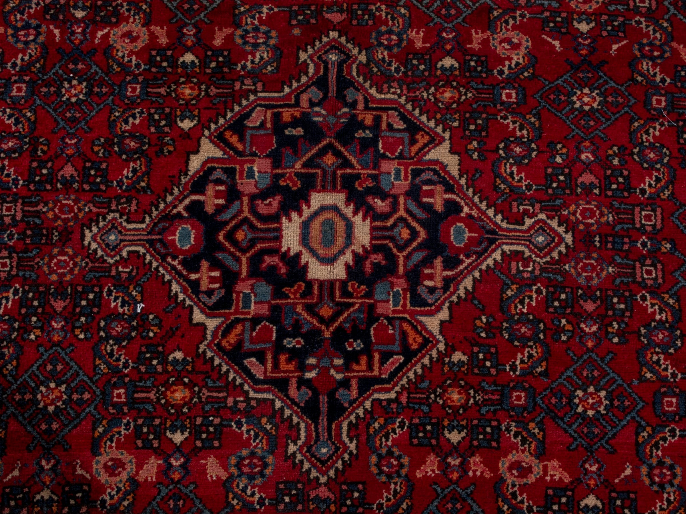 Persian Hosseinabad oversized rug in burgundy and navy, view 13 of 19