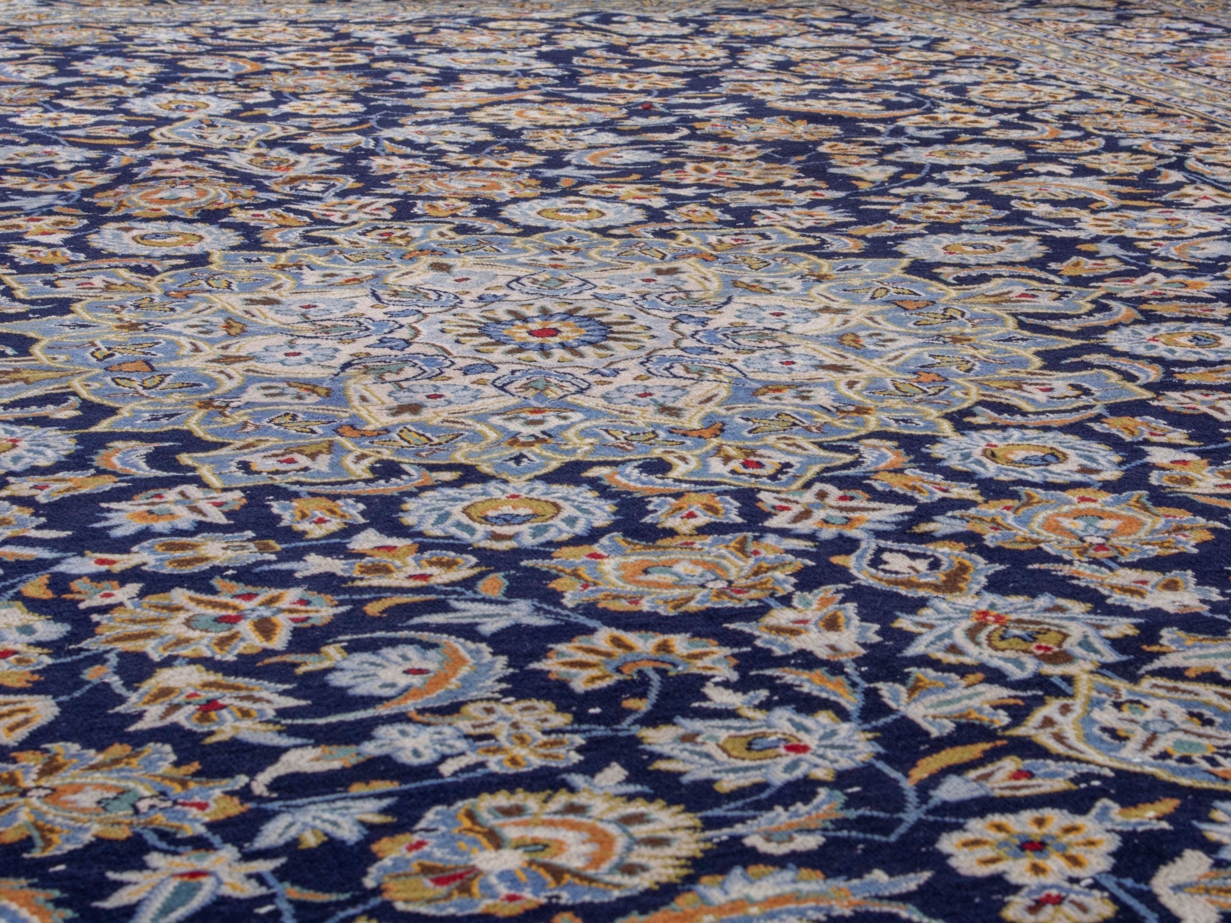 Persian Kashan oversized rug in navy and tan, view 8 of 19