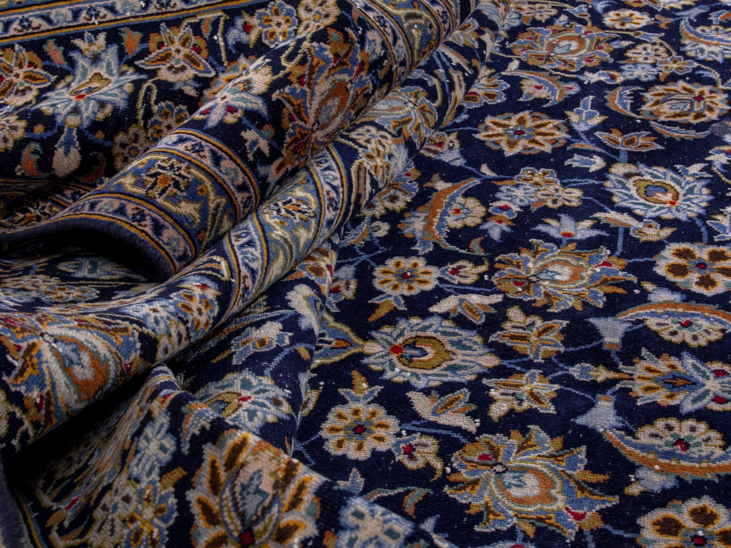Persian Kashan oversized rug in navy and tan, view 16 of 19