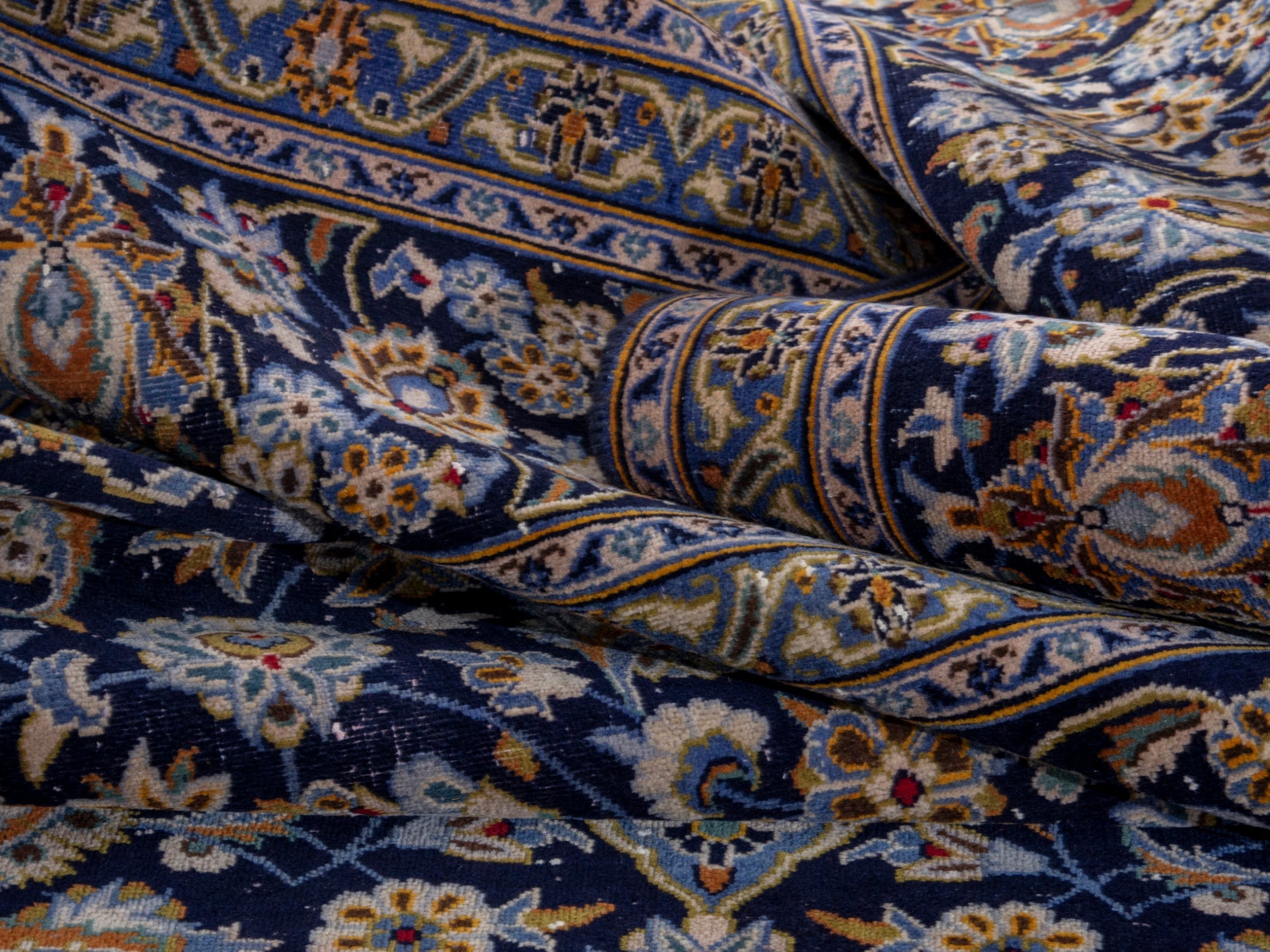 Persian Kashan oversized rug in navy and tan, view 17 of 19