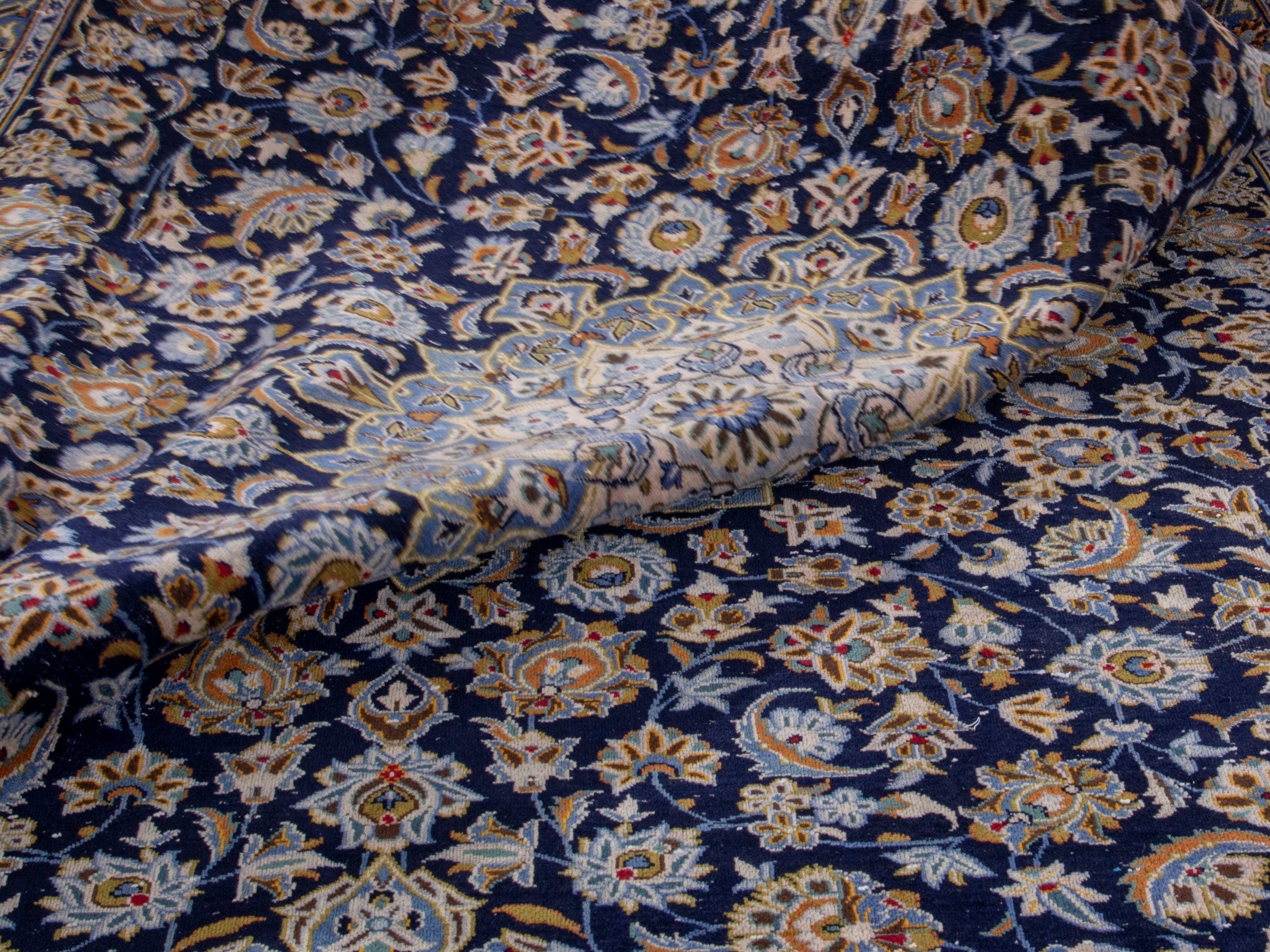 Persian Kashan oversized rug in navy and tan, view 18 of 19