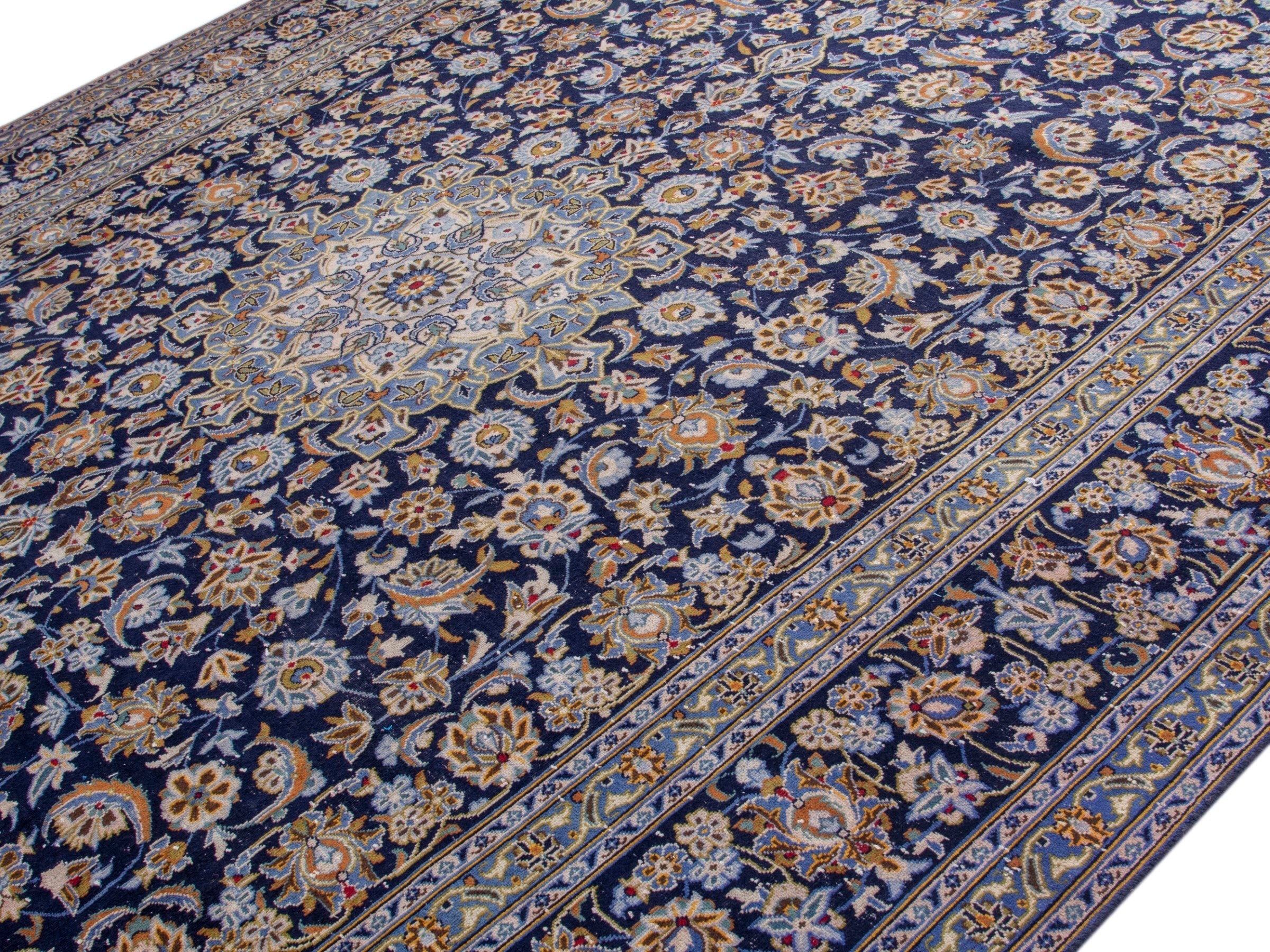 Persian Kashan oversized rug in navy and tan, view 4 of 19