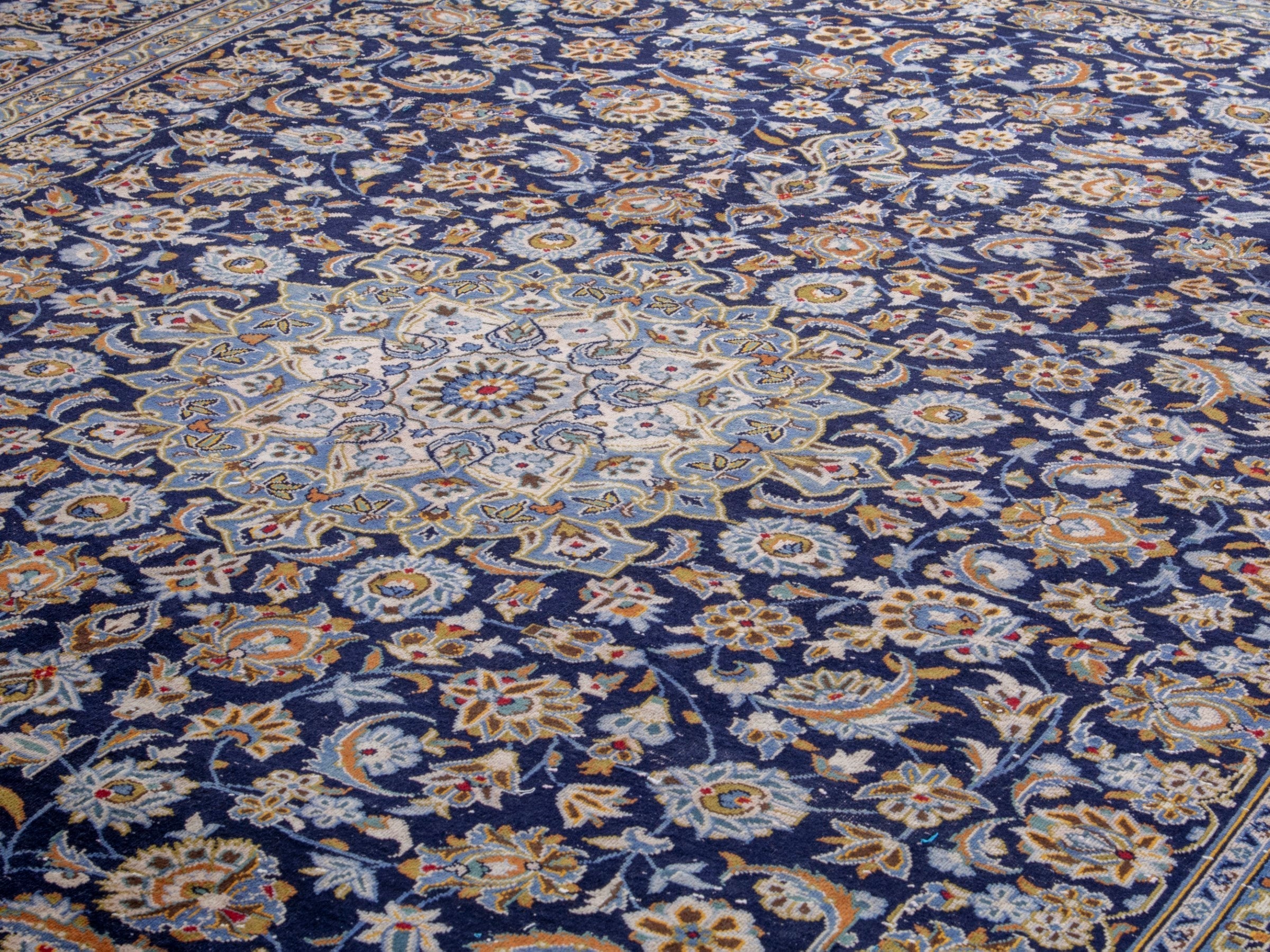 Persian Kashan oversized rug in navy and tan, view 7 of 19