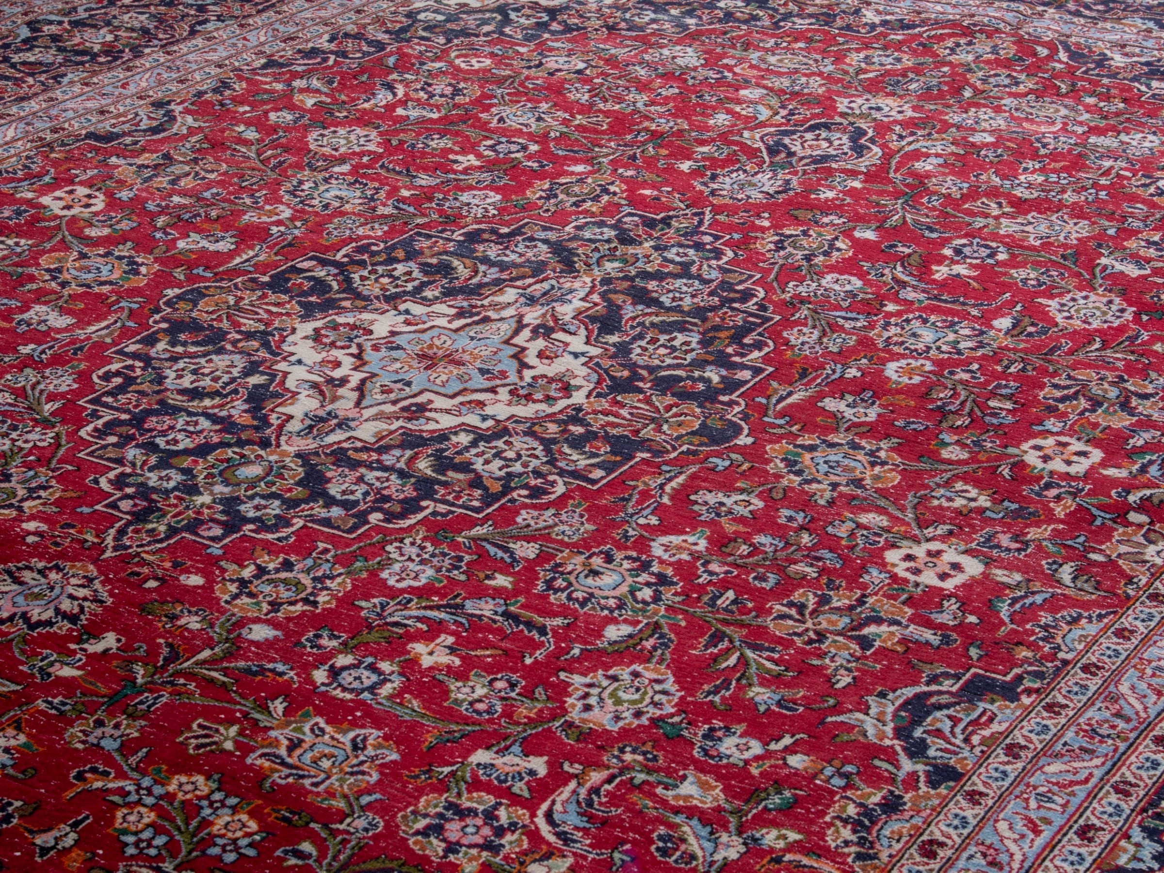 Persian Kashan oversized rug in deep red and dark brown, view 7 of 19