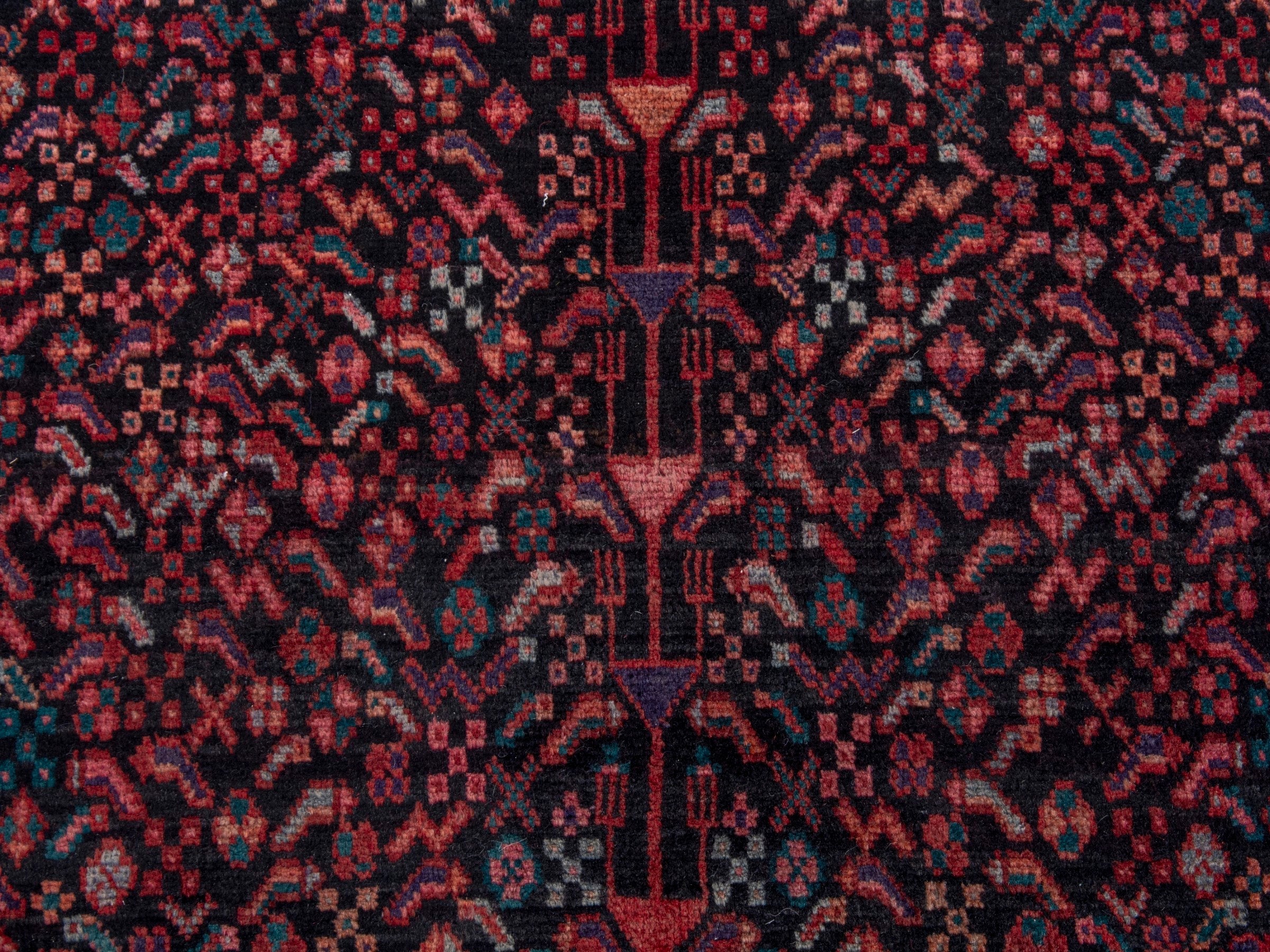 Persian Songhor area rug in navy and burgundy, view 12 of 18