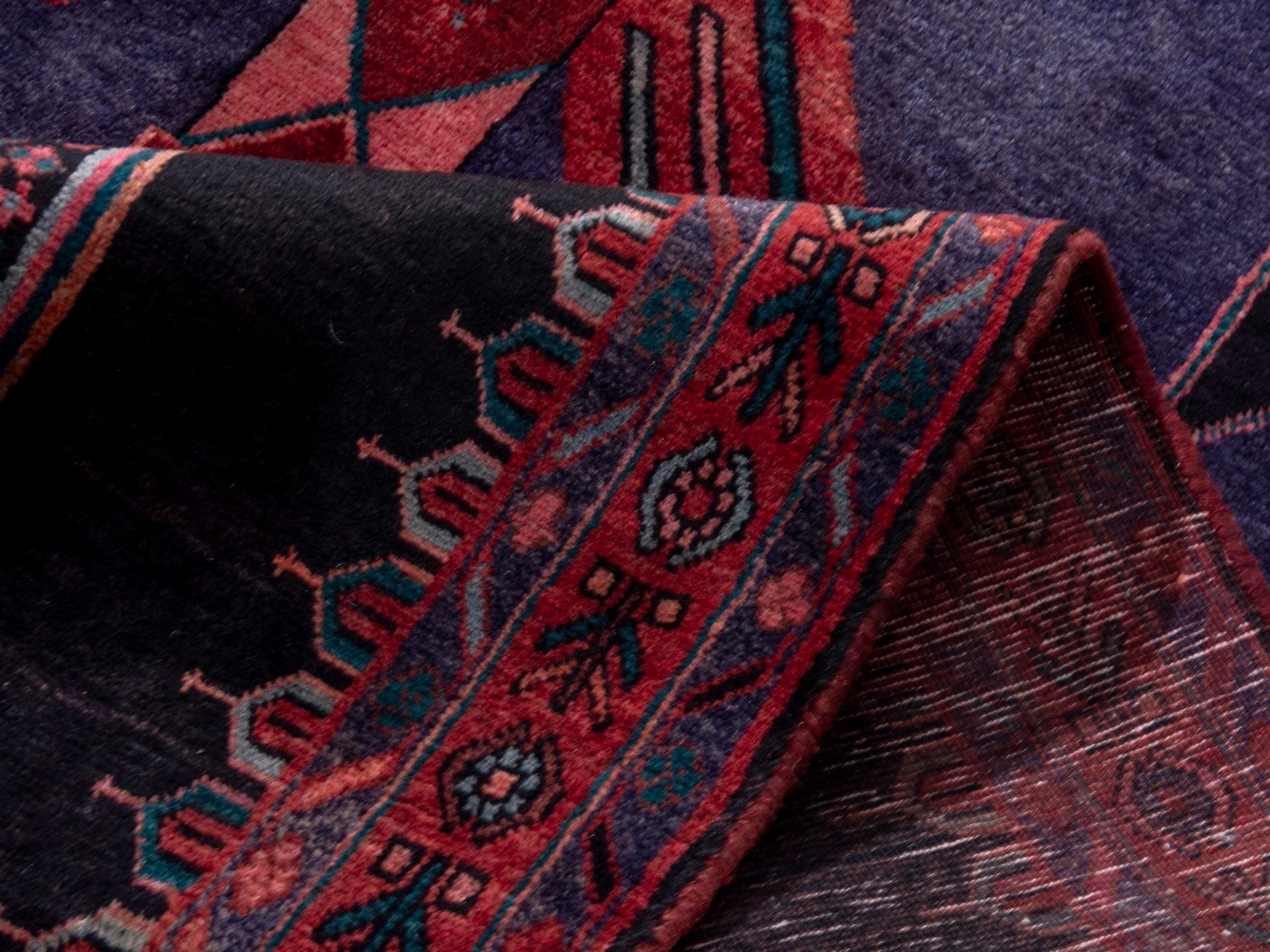 Persian Songhor area rug in navy and burgundy, view 15 of 18