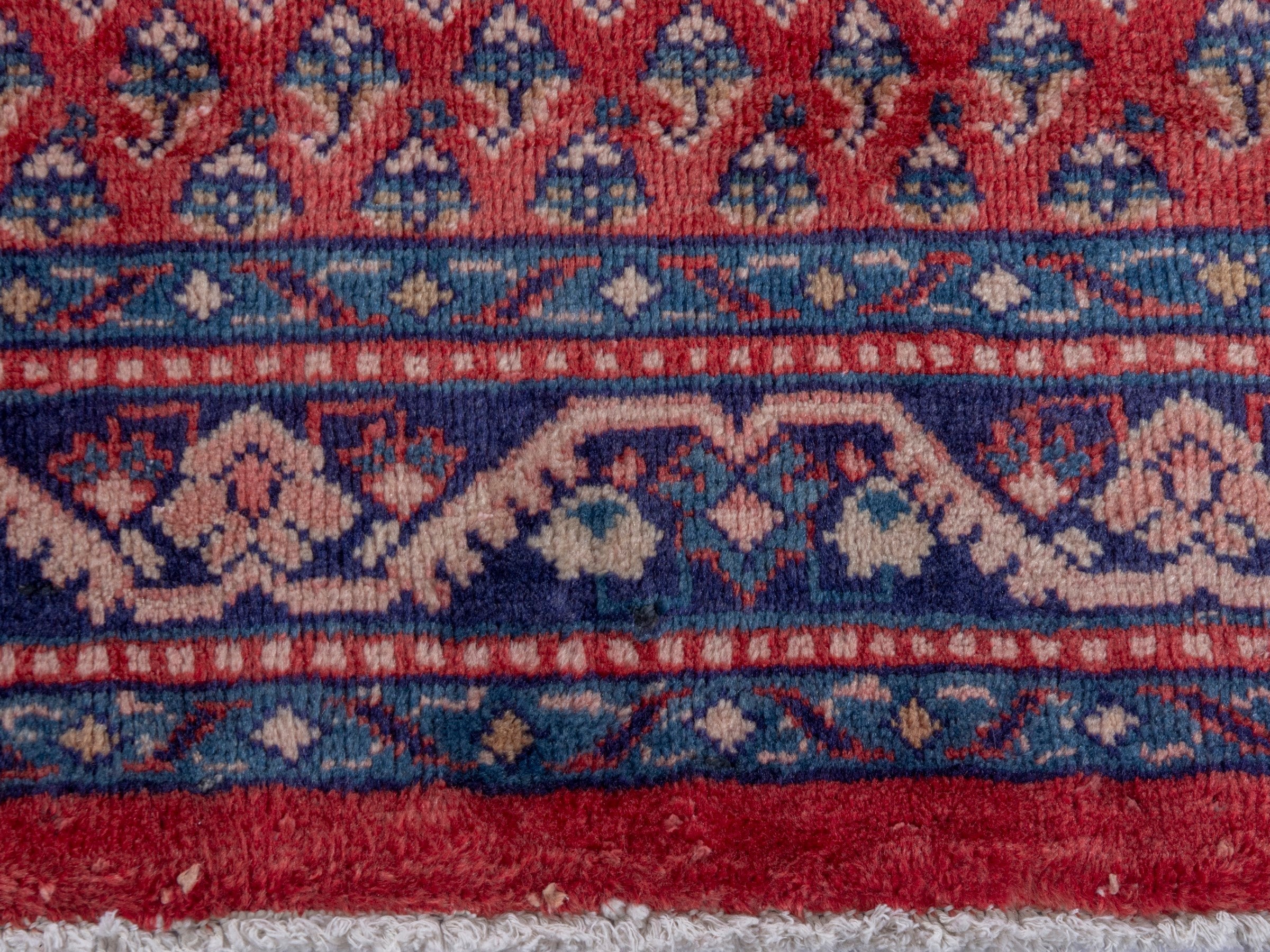 Persian Arak area rug in deep red and navy, view 11 of 20