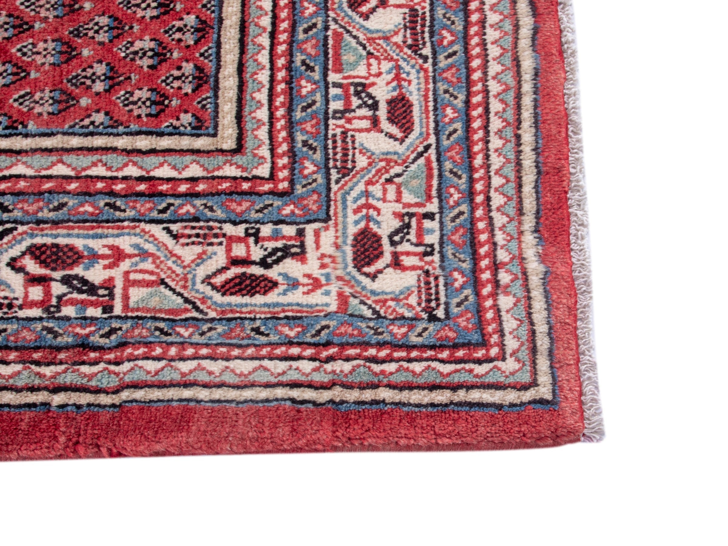 Persian Botteh area rug in deep red and cream, view 10 of 17