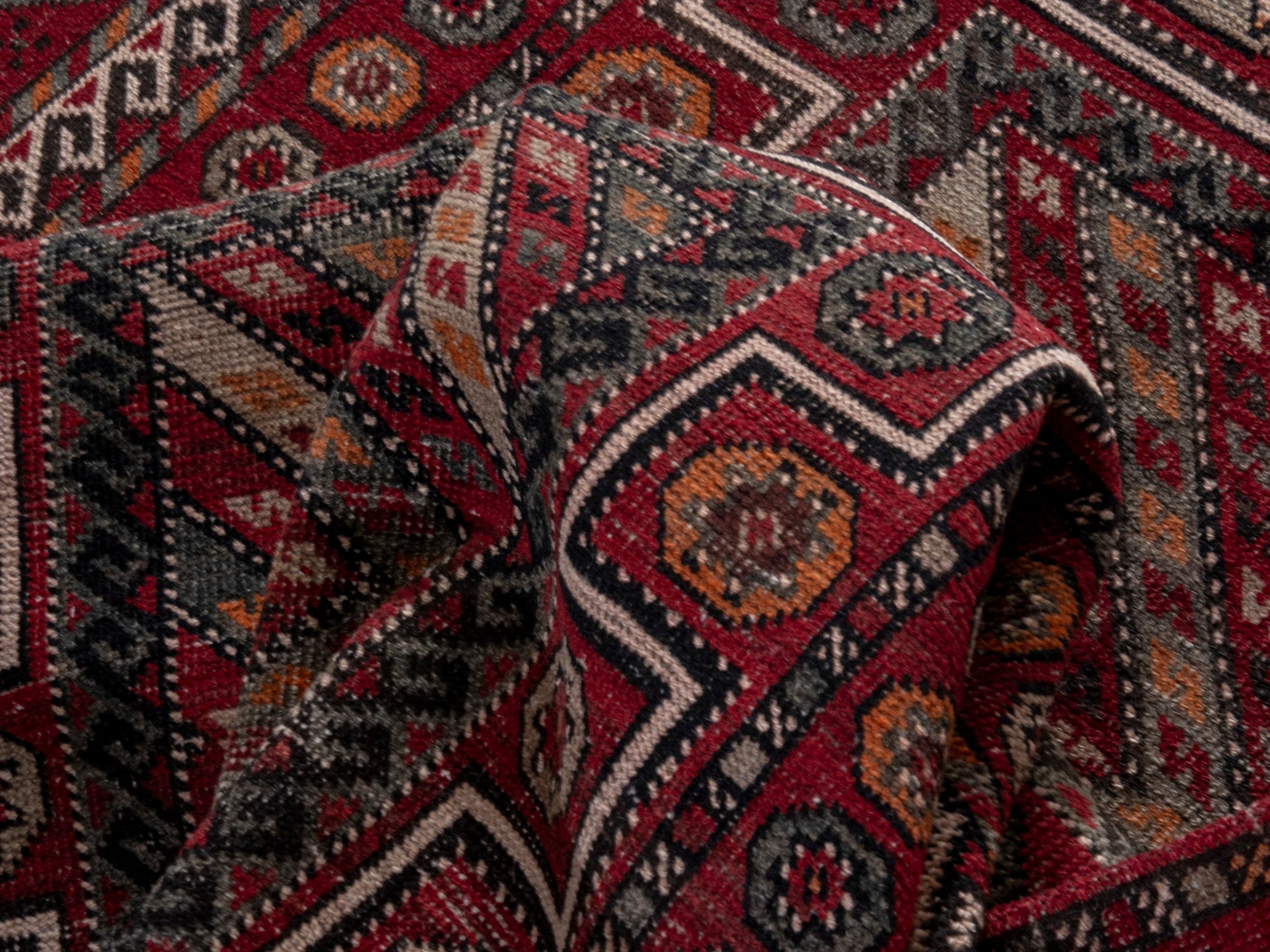 Persian Ghoochan area rug in deep red and rust, view 17 of 19