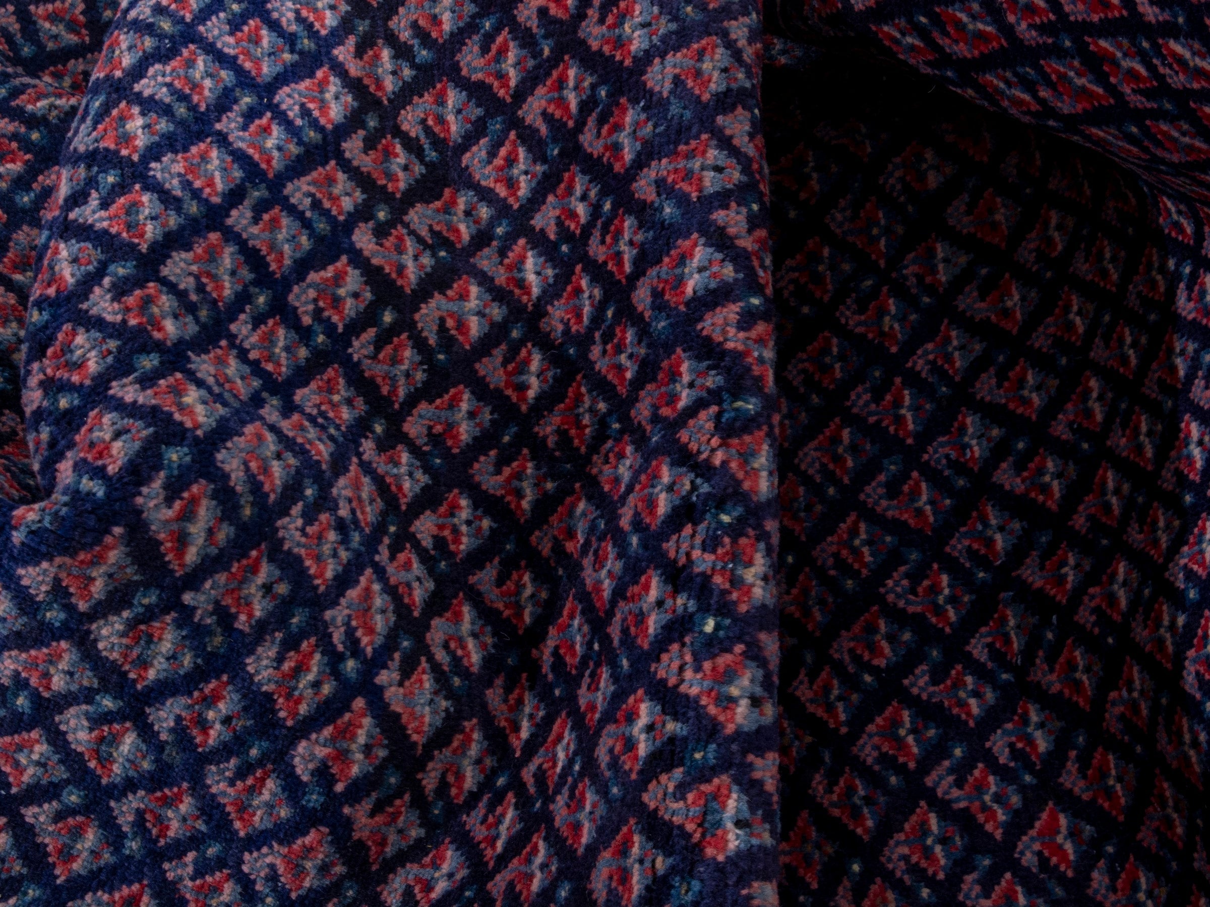 Persian Arak area rug in navy and dusty rose, view 18 of 19