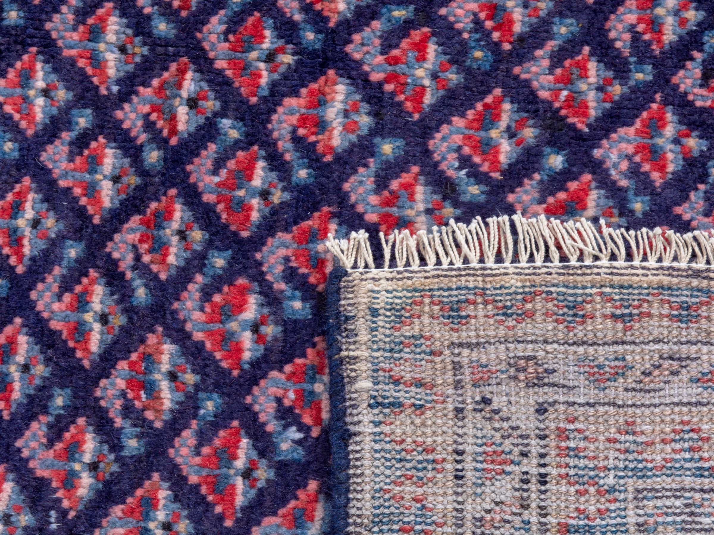Persian Arak area rug in navy and dusty rose, view 19 of 19