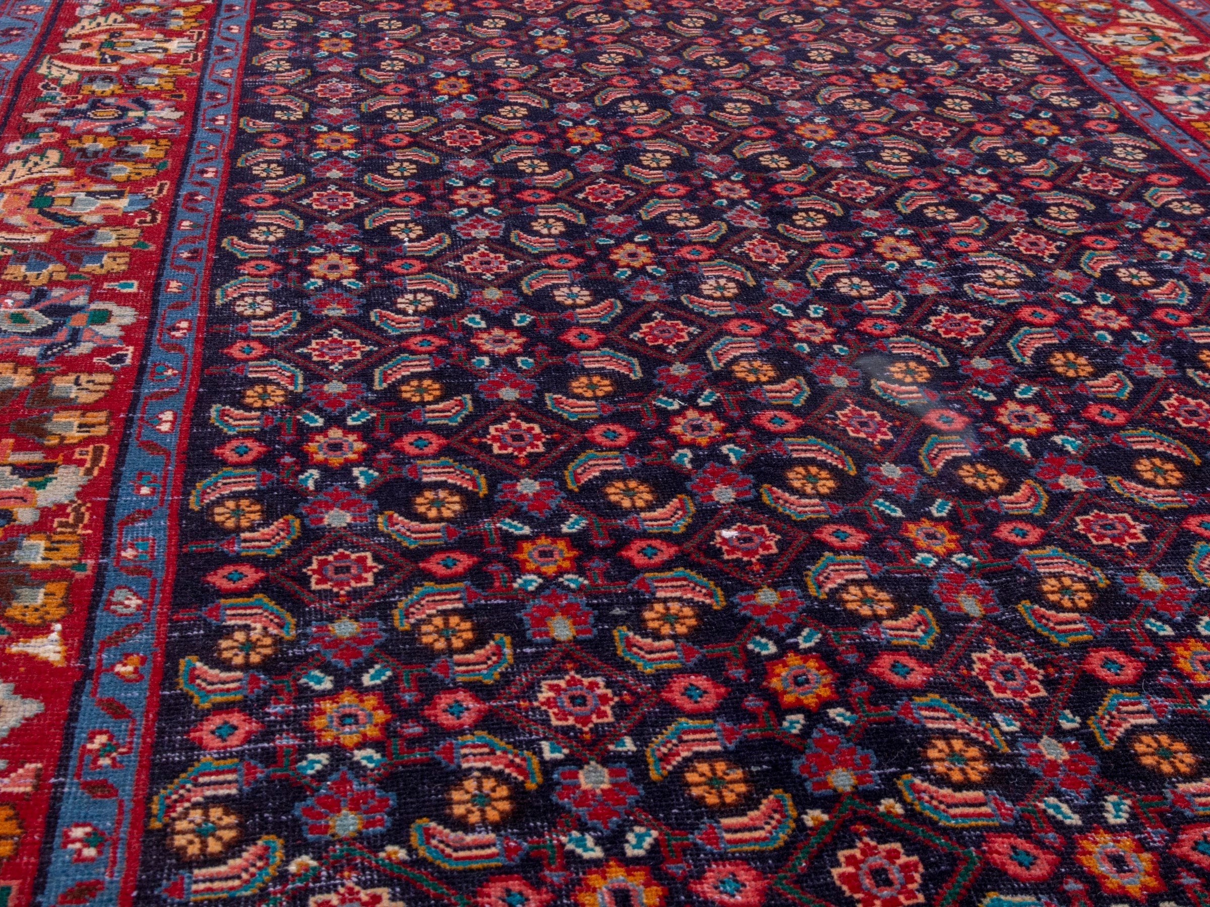 Persian Mahal area rug in navy and deep red, view 8 of 20