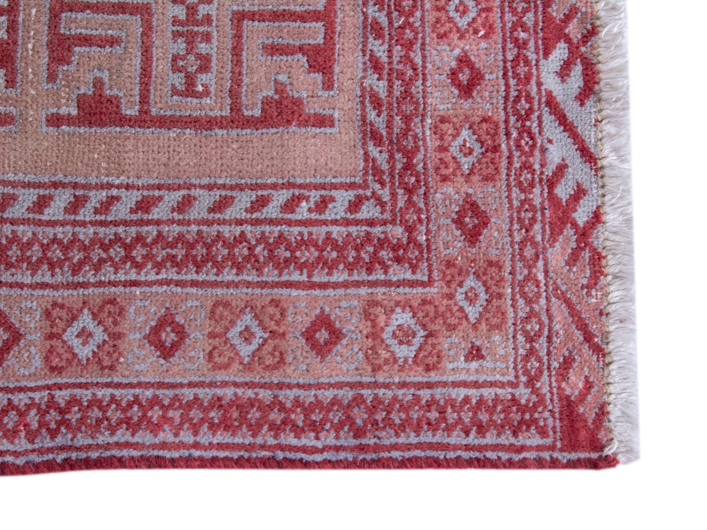 Persian Torkaman accent rug in muted pink and faded red, view 4 of 8