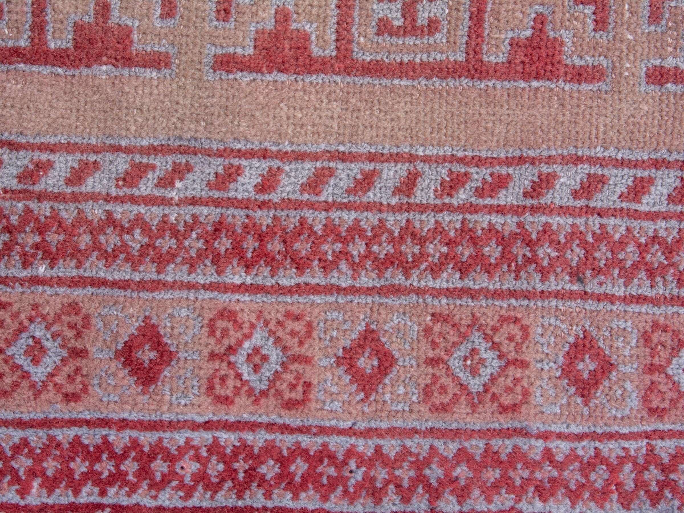Persian Torkaman accent rug in muted pink and faded red, view 6 of 8
