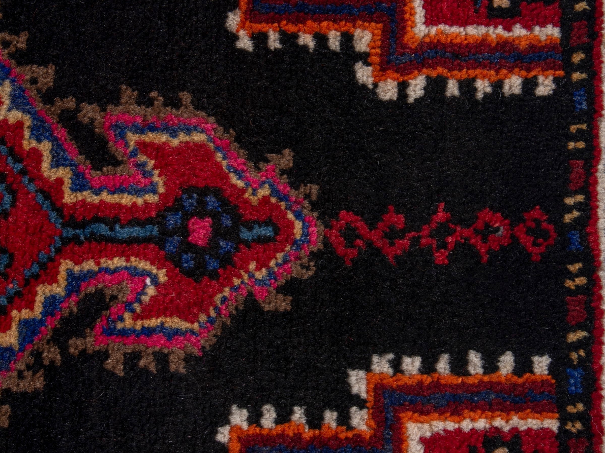 Persian Toyserkan accent rug in black and deep red, view 7 of 8